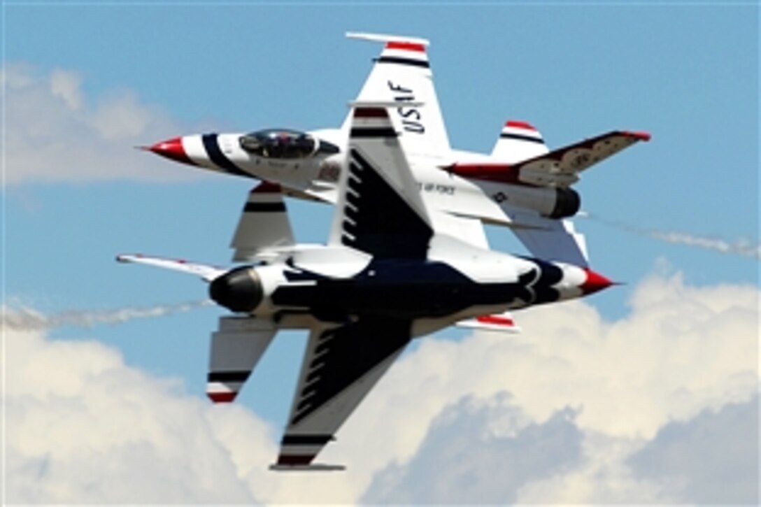 Air Force Majs. Blaine Jones and Jason Curtis perform the inverted opposing knife-edge pass during a practice show at the U.S. Air Force Academy in Colorado Springs, Colo., May 27, 2014.