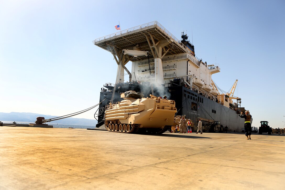 An Amphibious Assault Vehicle is offloaded from the USNS 1st Lt. Baldomero Lopez, a Maritime Prepositioning ship, during Exercise Eager Lion 2014, at the Port of Aqaba. Eager Lion is a recurring, multinational exercise designed to strengthen military-to-military relationships, increase interoperability between partner nations and enhance regional security and stability.(U.S. Marine Corps photo by Sgt. Laura Gauna/Released)