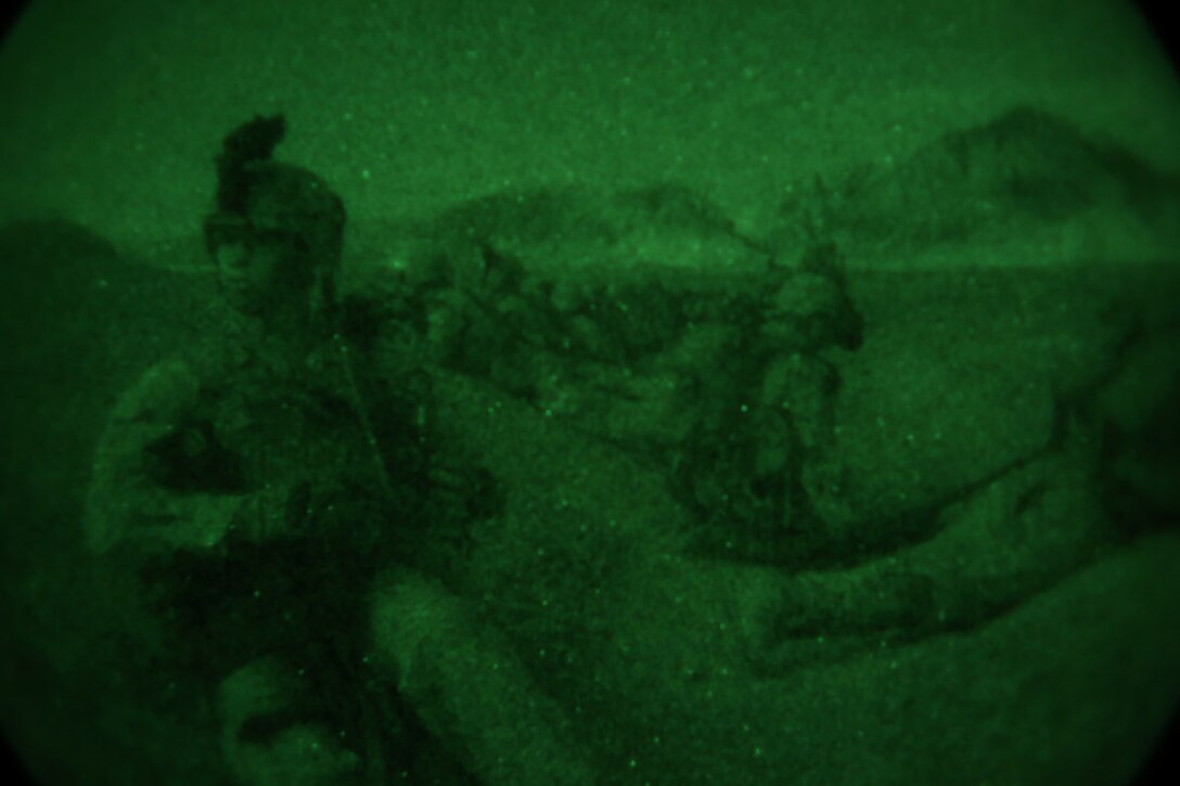Marines with Bravo Company, 1st Battalion, 7th Marine Regiment, provide security from a wadi after offloading from a CH-53E Super Stallion during a mission in Helmand province, Afghanistan, May 15, 2014. The company operated in Larr Village for two days to establish a presence and to disrupt enemy fighters. Throughout the mission the infantrymen conducted several patrols within the village and discovered hazardous materials which could be used to create improvised explosive devices.