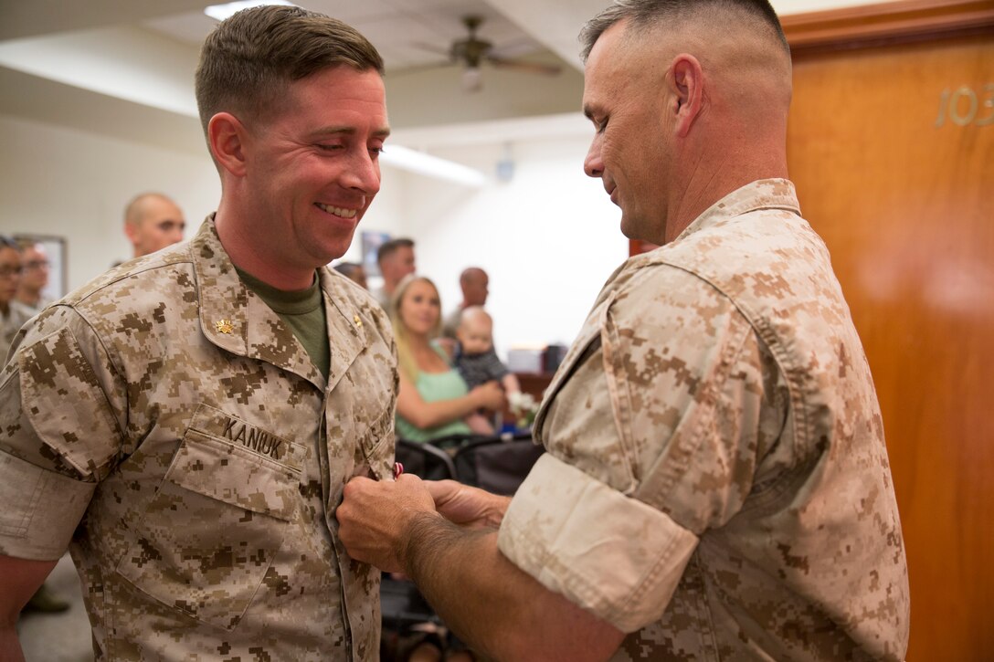 U.S. Marine Corps Maj. Michael Kaniuk is awarded the Meritorious Service Medal at the 12th Marine Corps District aboard Marine Corps Recruit Depot San Diego, June 2, 2014. Kaniuk was awarded for his achievements while being at the district. 