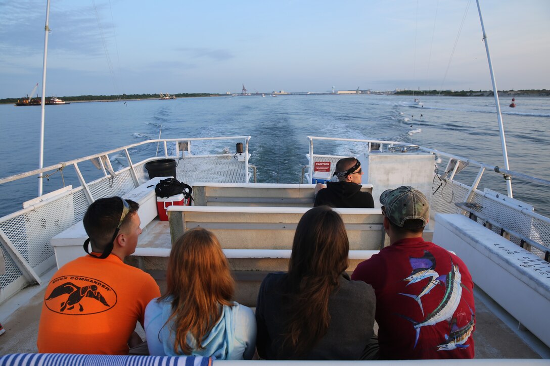Marines and Sailors enjoy a ride out to sea on the Carolina Princess during the Morehead City Military Appreciation Day May 31, 2014. The trip took the group 50 miles out for a day full of deep-sea fishing.