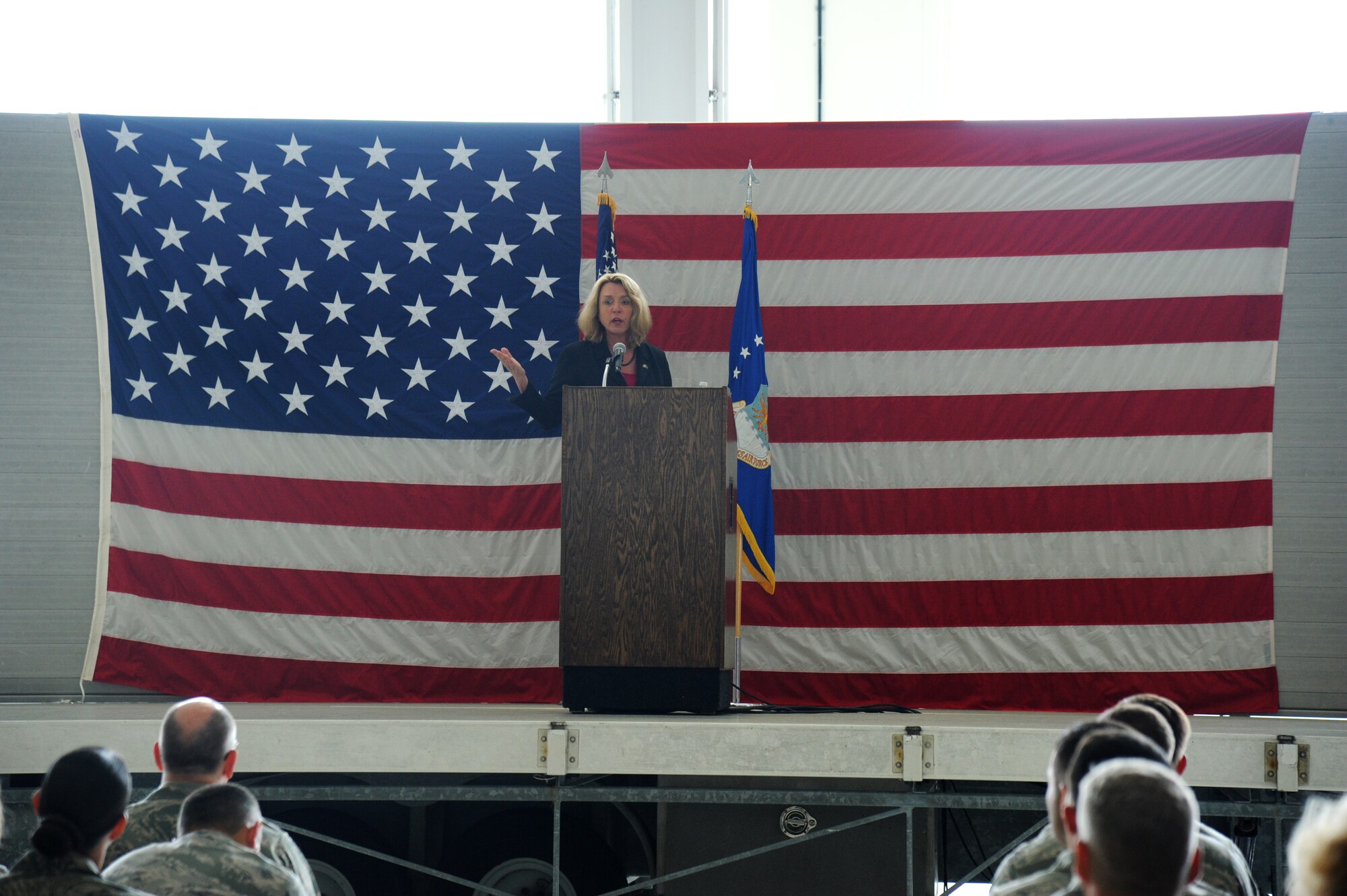 Secretary of the Air Force Deborah Lee James speaks to base personnel during an All Call at the dual bay hangar at Keesler Air Force Base, Miss. following a base orientation visit May 30, 2014. James also toured the Levitow Training Support Facility and the 403rd Wing. (U.S. Air Force photo by Kemberly Groue)