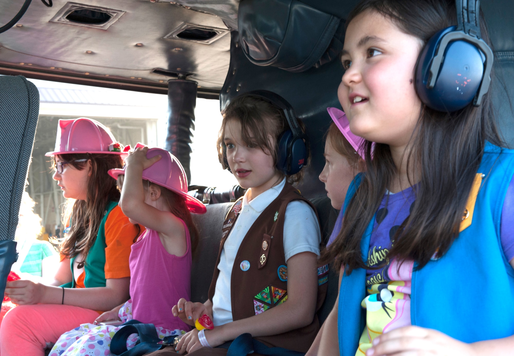 Girl Scouts sit inside a UH-1N Huey during Military SHeroes Day May 30, 2014, at Yokota Air Base, Japan. The Girl Scouts from Yokota partnered with their Japanese Girl Scouts counterparts for a cultural exchange event. (U.S. Air Force photo by Senior Airman Desiree Economides)
