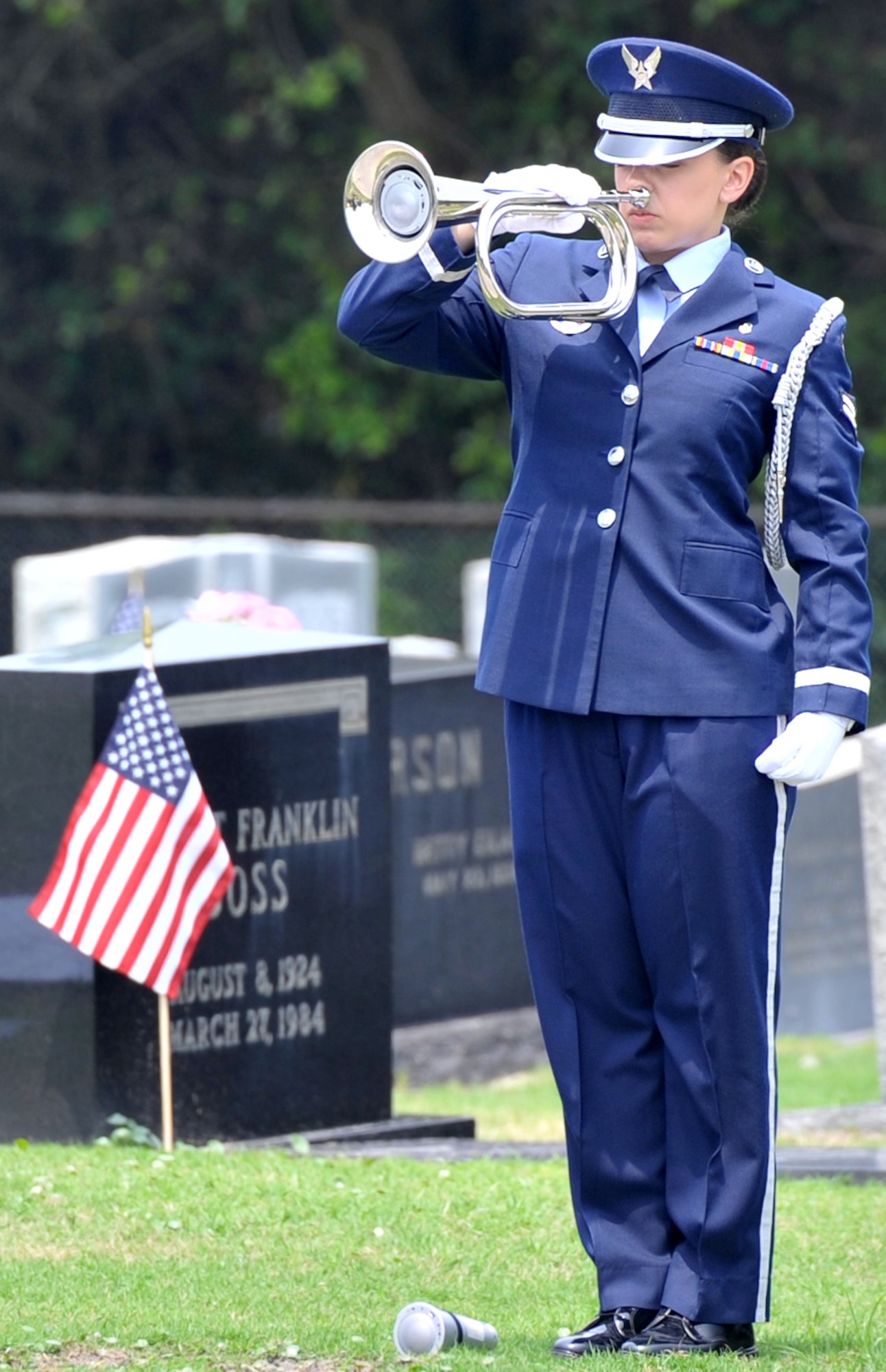 A member of the Eglin Air Force Honor Guard plays “Taps” during the American Legion Memorial Day Ceremony at the Destin Memorial Cemetery, Destin, Fla., May 26, 2014. The ceremony included a presentation of the colors, recitation of the Pledge of Allegiance, invocation, a T-6 Texan fly-over and a rifle salute by the Eglin Air Force Base Honor Guard. (U.S. Air Force photo/Senior Airman Kentavist P. Brackin)