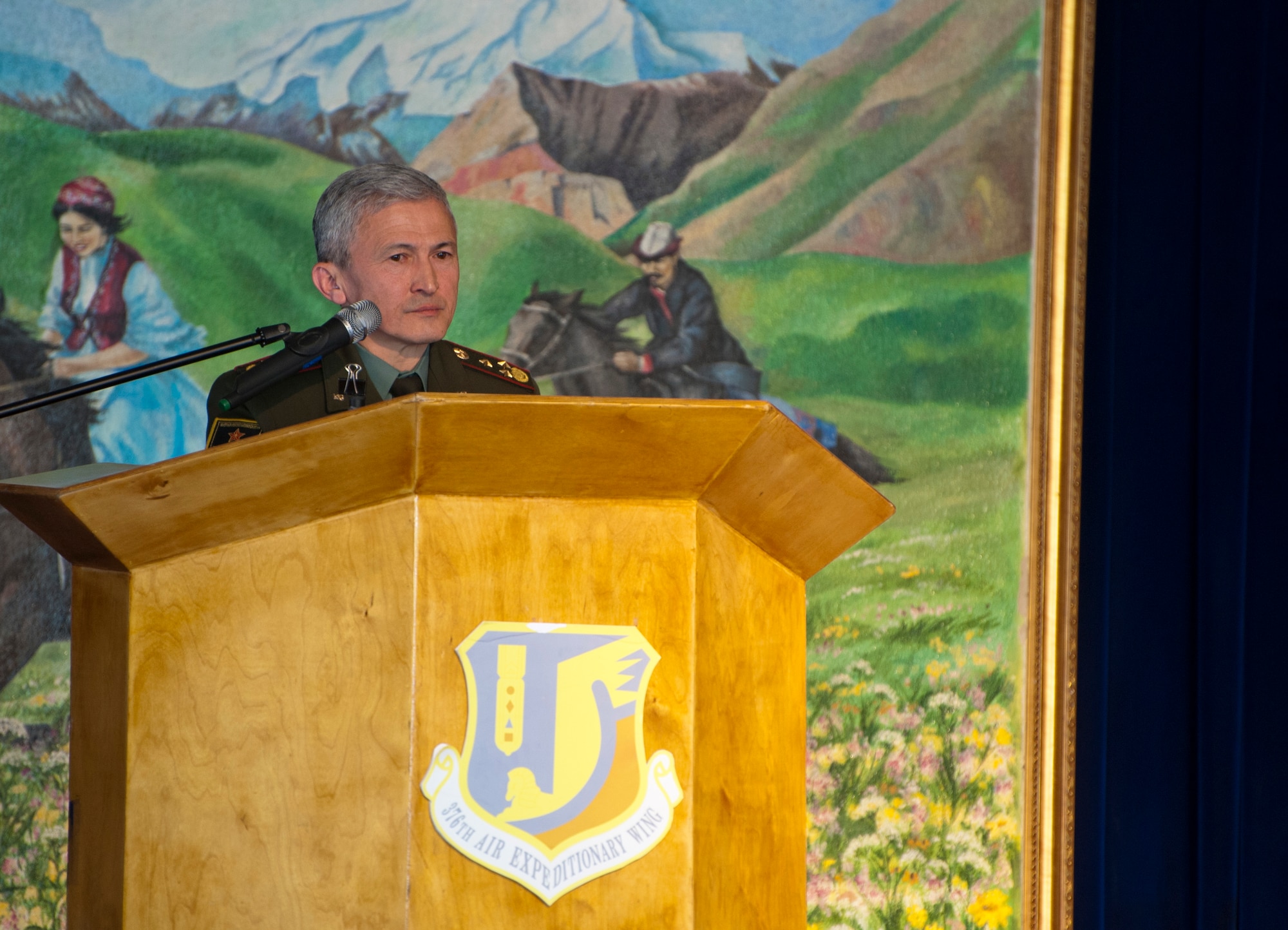 Col. Zamir Suerkulov, 1st Deputy Minister of the Kyrgyz Ministry of Defense, speaks about the close relationship between the Kyrgyz and American militaries during a Transfer Ceremony at the Transit Center at Manas, Kyrgyzstan, June 3, 2014. He praised the exchanged opportunities that included pilots, medical personnel, language training and even sports competitions.  (U.S. Air Force Photo/Senior Airman Ross Alexander Whitley)