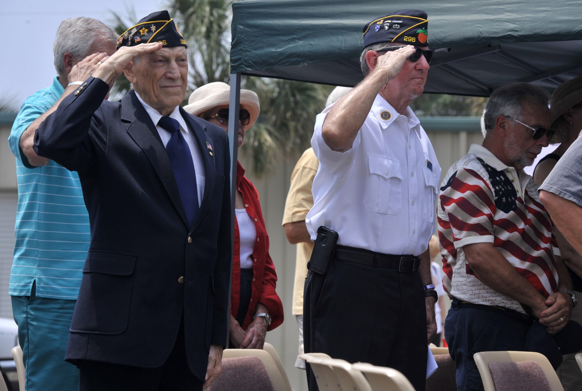 Service and local community members render honors during the playing of “Taps” at the American Legion Memorial Day Ceremony at the Destin Memorial Cemetery, Destin, Fla., May 26, 2014. Memorial Day was originally known as Decoration Day and held on May 30. It is now commemorated on the last Monday in May. (U.S. Air Force photo/Senior Airman Kentavist P. Brackin)