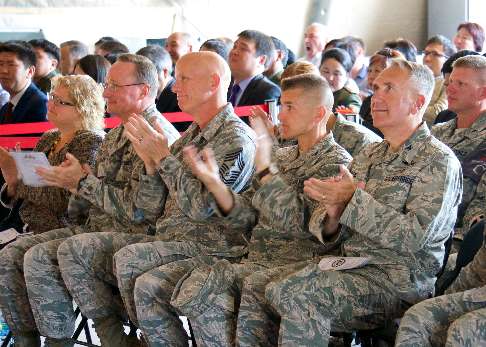 Airmen, U.S. Embassy personnel, Bishkek, and local news media watch the Transit Center at Manas Transfer Ceremony on June 3, 2013. The event signified the symbolic transfer of control of the Transit Center between the United States and Kyrgyz governments. The facility stood up 12 and a half years ago after the terrorist attacks in America on Sept. 11, 2001. The center was the premier transportation and logistics hub supporting combat operations for Operation Enduring Freedom. (Photo courtesy of Capt. Cory O'Brien)
