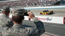 Team Dover honorary pit crew members for Jeb Burton, No. 13 car truck in the Camping World Truck Series race, May 30, 2013, at Dover International Speedway in Dover, Del. The honorary pit members had the opportunity to see the NASCAR race from a different perspective. (U.S. Air Force photo/Senior Airman Jared Duhon)