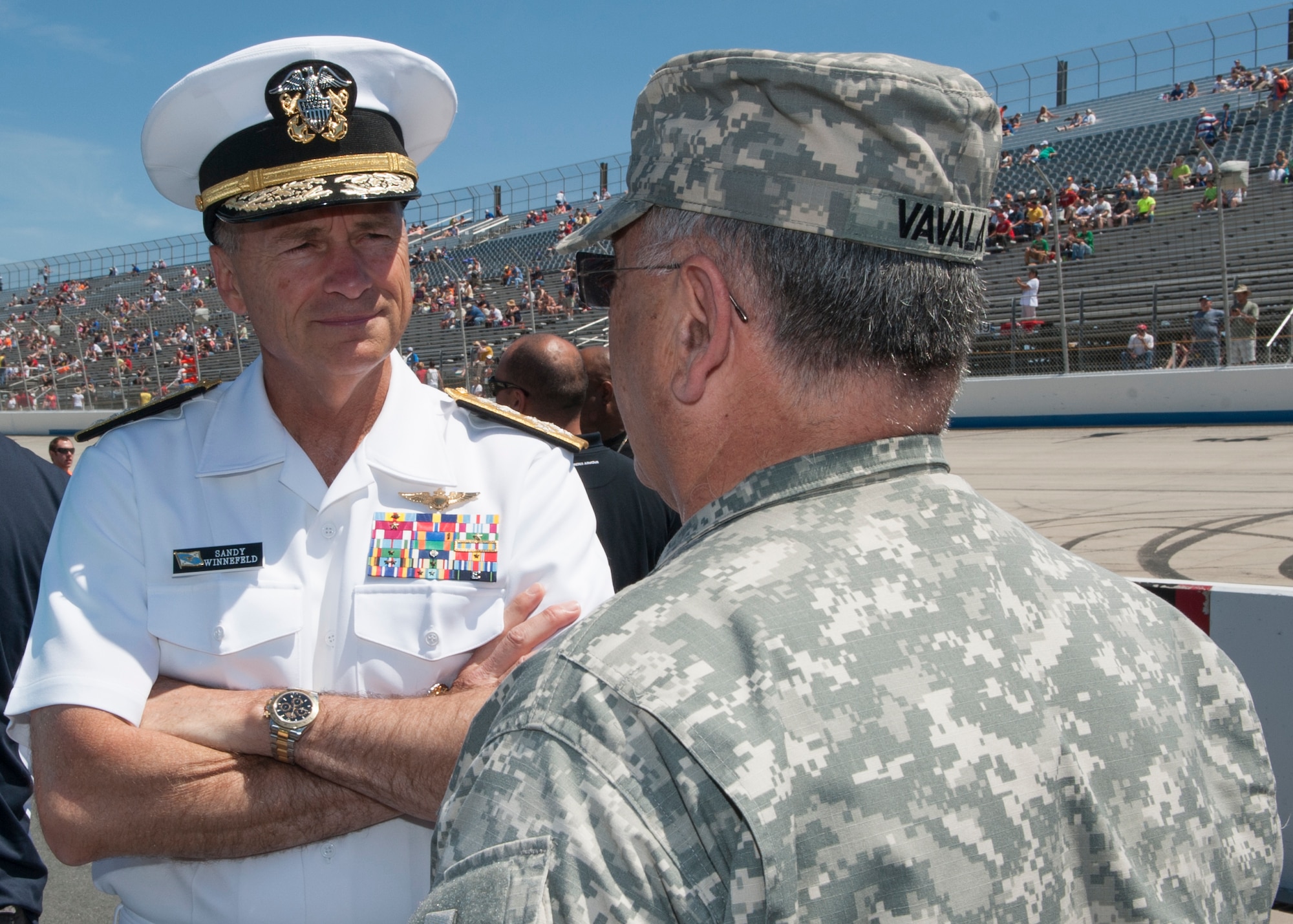 Adm. James A. Winnefeld, Jr., Vice Chairman of the Joint Chiefs of Staff, talks to Maj. Gen. Francis D. Vavala, Delaware Army National Guard adjunct general, during the pre-race of the FedEx 400 benefiting Autism Speaks June 1, 2014, at Dover International Speedway in Dover, Del. Adm. Winnefeld was at the race to honor America and the men and women who have volunteered to serve the U.S. (U.S. Air Force photo/Airman 1st Class Zachary Cacicia)