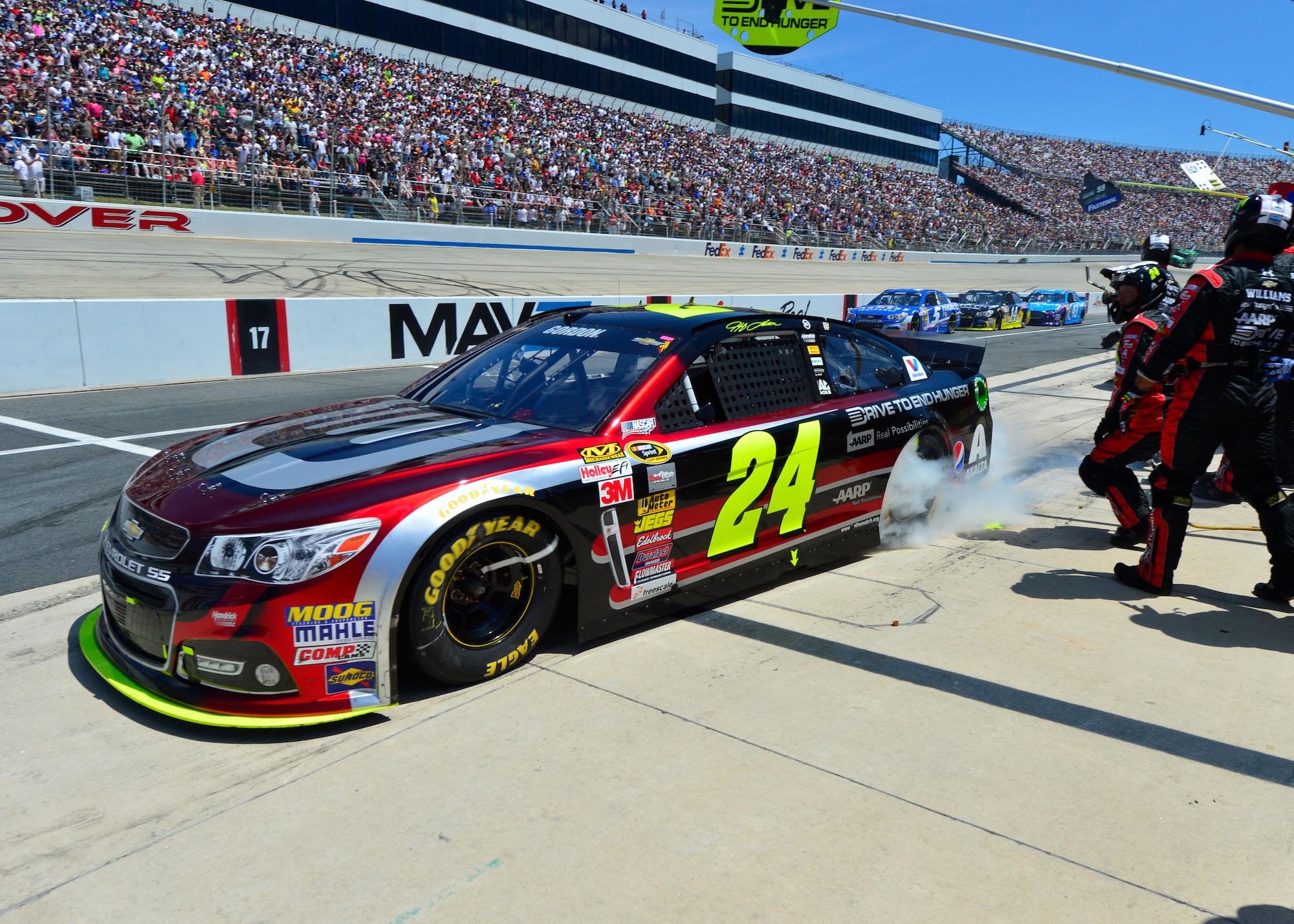 Jeff Gordon, driver of the No. 24 Drive to End Hunger Chevrolet, speeds out of the pits after a pit stop June 1, 2014 during the FedEx 400 at the Dover International Speedway in Dover, Del. Gordon finished the race in 15th place after qualifying number six. (U.S. Air Force photo/Airman 1st Class William Johnson)