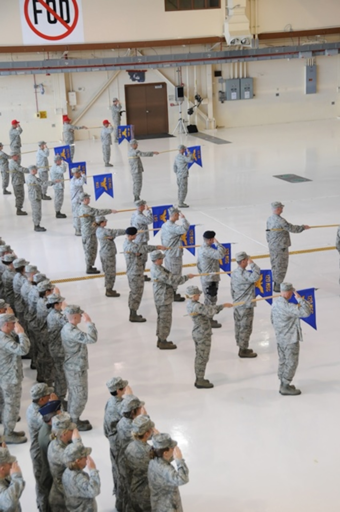 Airmen from the 120th Airlift Wing stand in formation during a change of mission ceremony at the Montana Air National Guard May 31.  The wing officially changed from a fighter wing to an airlift wing on March 1. (National Guard photo/Master Sgt. Jason Johnson)