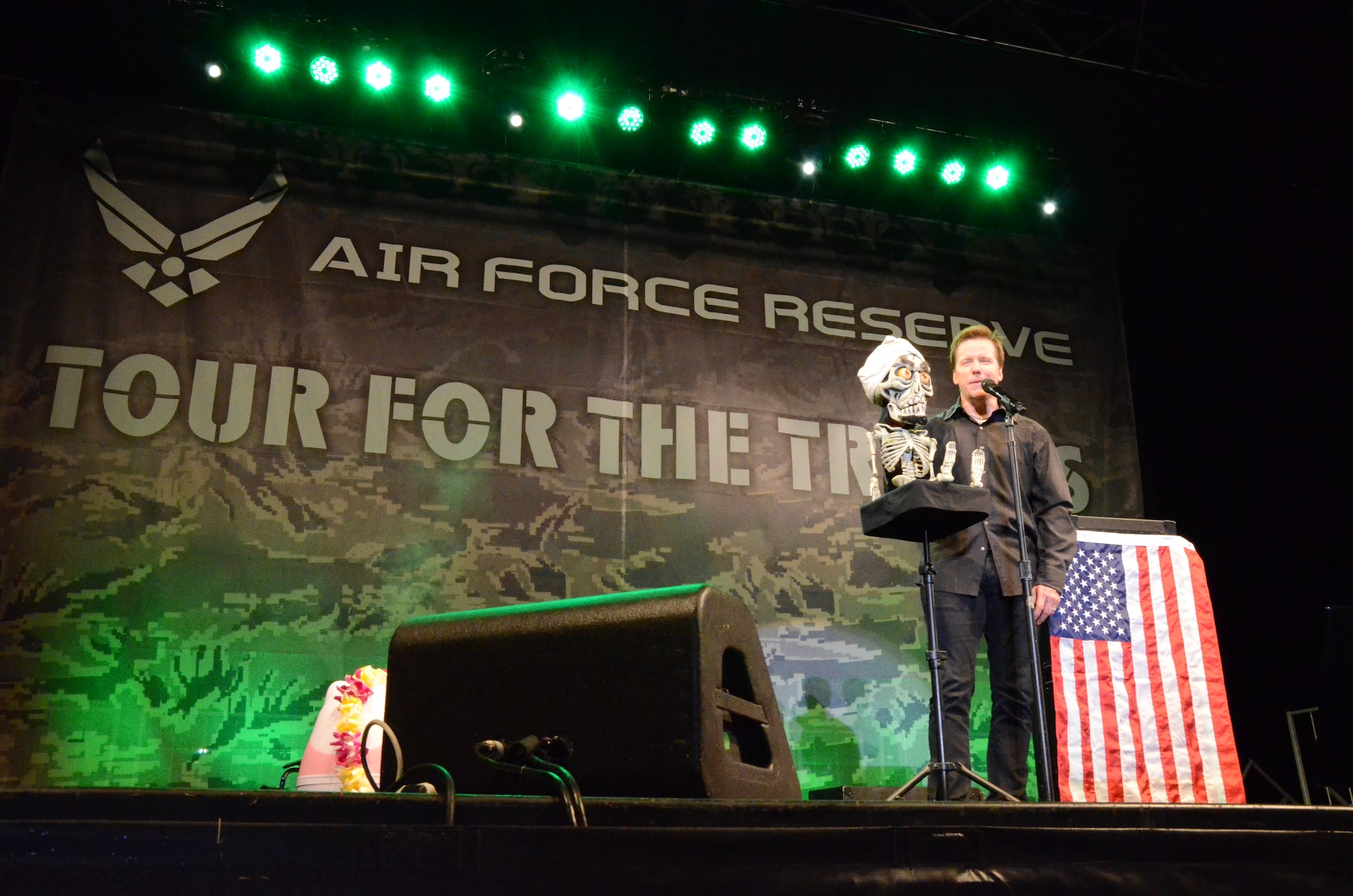Well-known ventriloquist and comedian Jeff Dunham performs on-stage with one of his famous puppets called, "Achmed," at an Air Force Reserve Command-sponsored Memorial Day weekend event--"Tour for the Troops"--held at Ward Field, Naval Station Pearl Harbor, Joint Base Pearl Harbor-Hickam, Hawaii, May 24, 2014. (U.S. Air Force photo by Tech. Sgt. Phyllis Keith)