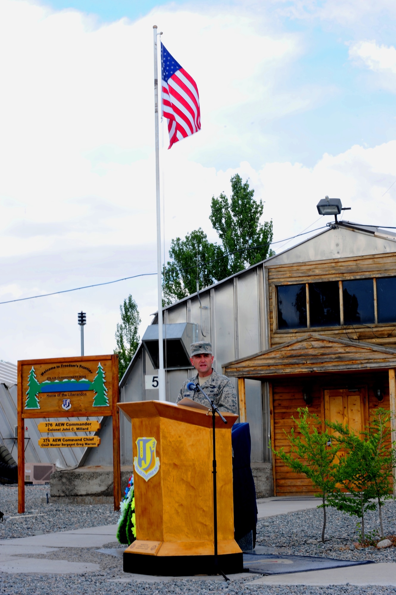 Col. John Millard, commander of the 376th Air Expeditionary Wing, speaks during the wing's inactivation ceremony at Transit Center at Manas, Kyrgyzstan, June 3, 2014. At the height of operations, approximately 1,500 U.S. military personnel were assigned to the wing, along with approximately 900 U.S. and host-nation contractor personnel who provided daily support to various base missions.  (U.S. Air Force Photo/Lt. Col. Max Despain)
