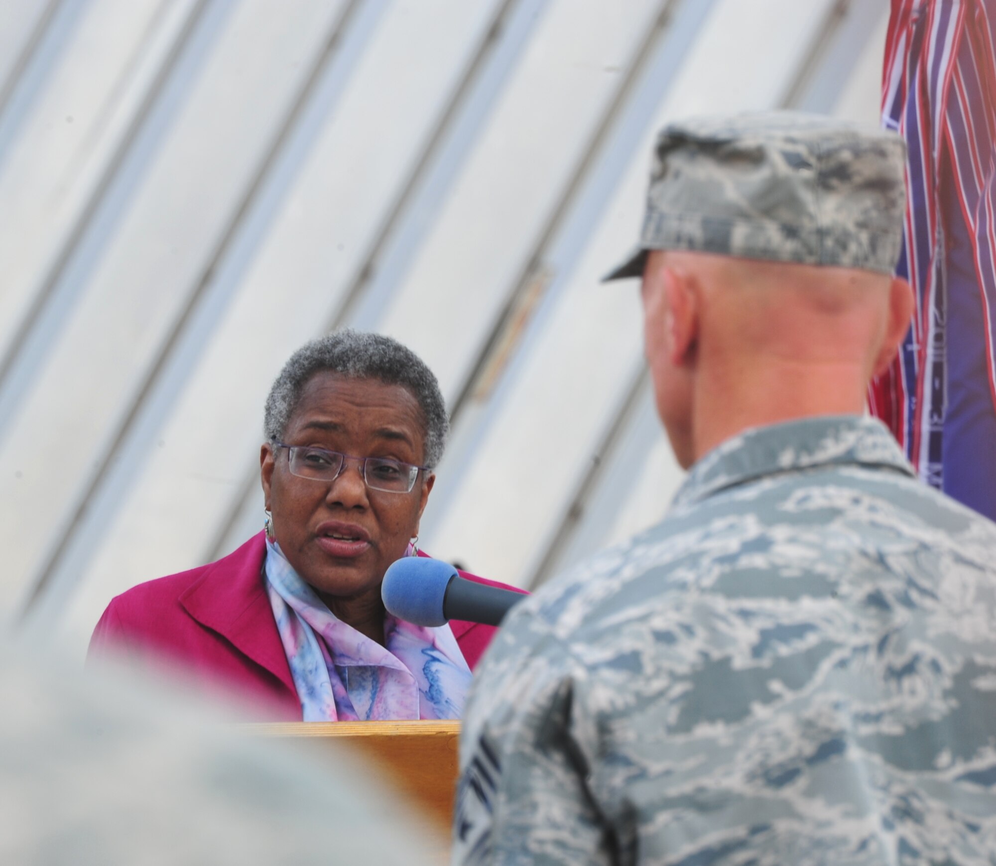 The Honorable Pamela Spratlen, U.S. Ambassador to the Kyrgyz Republic, speaks during the 376th Air Expeditionary Wing's inactivation ceremony at Transit Center at Manas, Kyrgyzstan, June 3, 2014. The ceremony involved comments from Col. John Millard, 376th AEW commander, as well as sheathing the squadron, group, and wing guidons.  (U.S. Air Force Photo/Lt. Col. Max Despain)