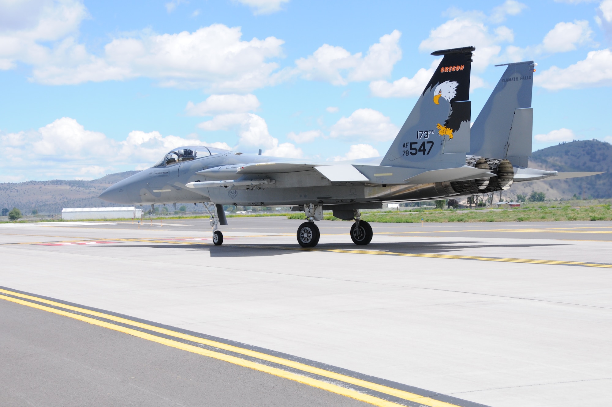 The 173rd Fighter Wing F-15 Eagle Command jet taxis to the runway in preparation for a training mission at Kingsley Field, Klamath Falls, Ore. May 28, 2014.  The 173rd Fighter Wing is the sole F-15C training base for the United States Air Force and is set to expand its mission this fall with the introduction of Active Duty personnel with a Total Force Initiative.  (U.S. Air National Guard photo by Master Sgt. Jennifer Shirar/Released)