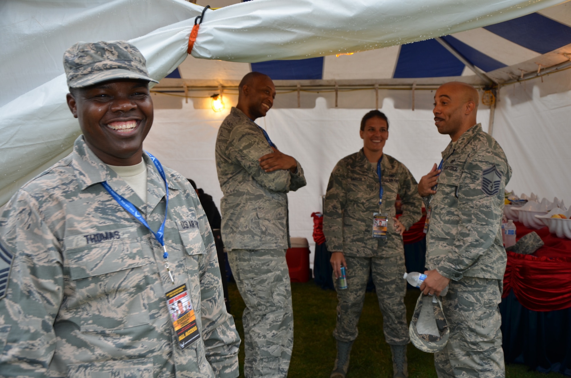 From left, Senior Master Sgt. Darin Thomas, functional manager for Air Force Reserve Recruiting Service, Robins Air Force Base, Georgia, shares a laugh pre-show at the VIP tent with Maj. Thomas McClyde, Jr., operations officer for Western Recruiting Squadron, Air Force Reserve Recruiting Service, Robins Air Force Base, Georgia; Master Sgt. Sachel Garcia, line recruiter for Air Force Reserve Recruiting Service, Pacific Air Forces, Joint Base Pearl Harbor-Hickam, Hawaii, and Senior Master Sgt. Carl Nixon, flight chief for Air Force Reserve Recruiting Service, Pacific Air Forces, Joint Base Pearl Harbor-Hickam, Hawaii at an Air Force Reserve Command-sponsored Memorial Day weekend event held at Ward Field, Naval Station Pearl Harbor, Joint Base Pearl Harbor-Hickam, Hawaii, May 24, 2014. (U.S. Air Force photo by Tech. Sgt. Phyllis Keith)