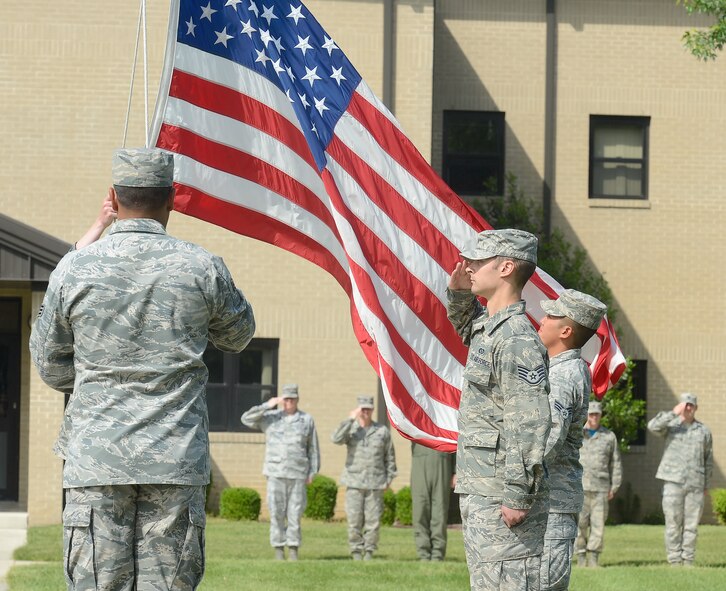 Members of the 436th Civil Engineer Squadron lower the American flag during a formal retreat ceremony May 30, 2014, at Dover Air Force Base, Del. All four flag detail members are structural craftsman with the 436th Civil Engineer Squadron. (U.S. Air Force photo/Greg L. Davis) 