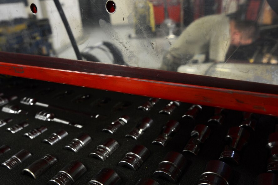 U.S. Air Force Senior Airman Dexter Tapley, 20th Logistics Readiness Squadron vehicle maintenance journeyman, performs maintenance on a 20th Civil Engineer Squadron truck at Shaw Air Force Base, S.C., June 3, 2014. Tapley, a 24-year-old Olive Branch Miss. native, spent several hours figuring out what was wrong with the truck after it came to vehicle maintenance with engine problems. (U.S. Air Force photo by Airman 1st Class Jensen Stidham/Released)
