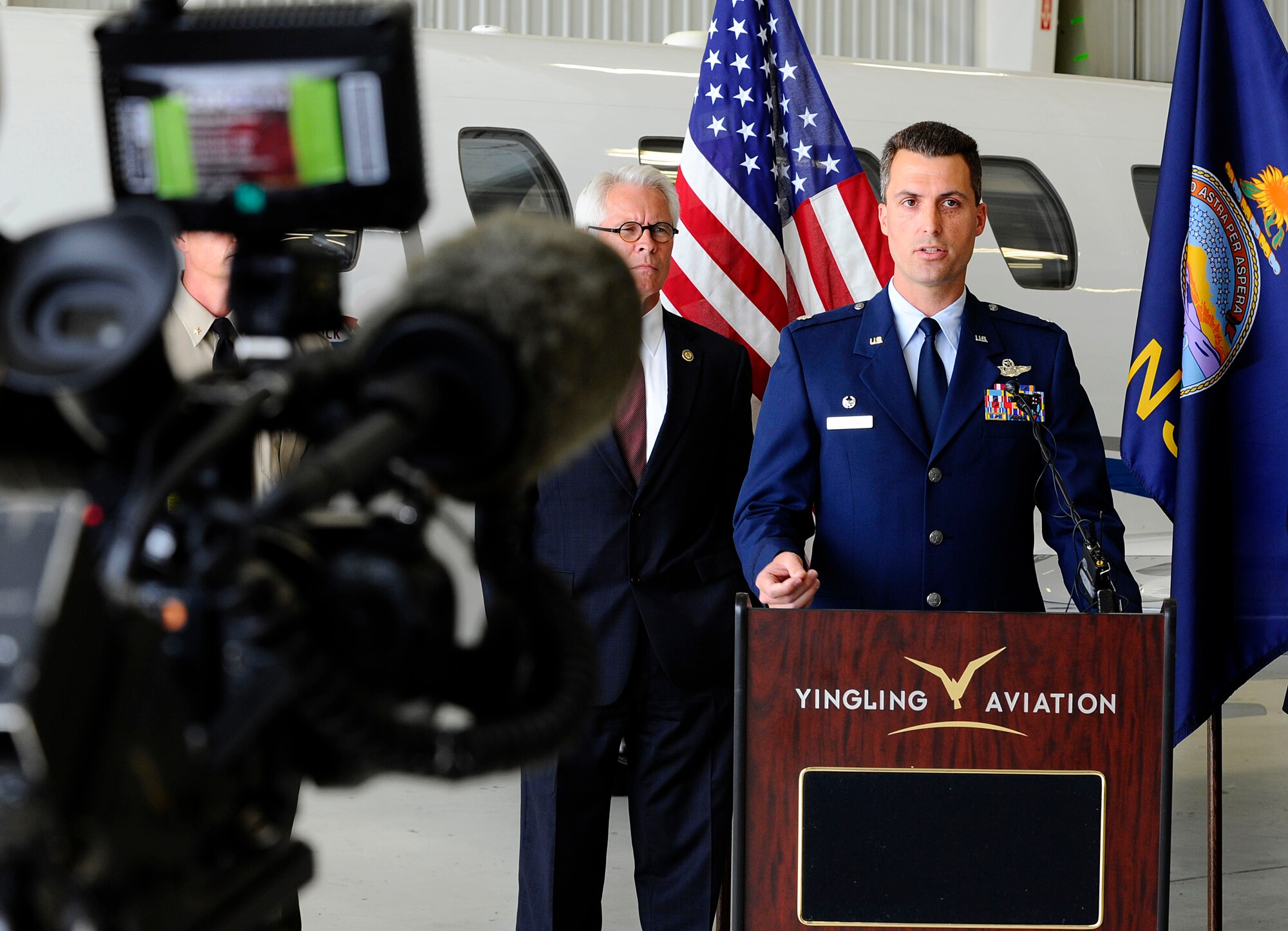 Lt. Col. Stephen Matthews, 349th Air Refueling Squadron commander, delivers a statement during a joint press conference, June 3, 2014, in Wichita, Kan. Matthews was the McConnell Air Force Base, Kan., representative during the conference, during which the FBI announced a national campaign to address the issue of individuals pointing lasers at the cockpits of private, commercial and military aircraft. Such incidents can endanger aircrew, passengers and the communities surrounding airfields. (U.S. Air Force photo/Airman 1st Class Victor J. Caputo)