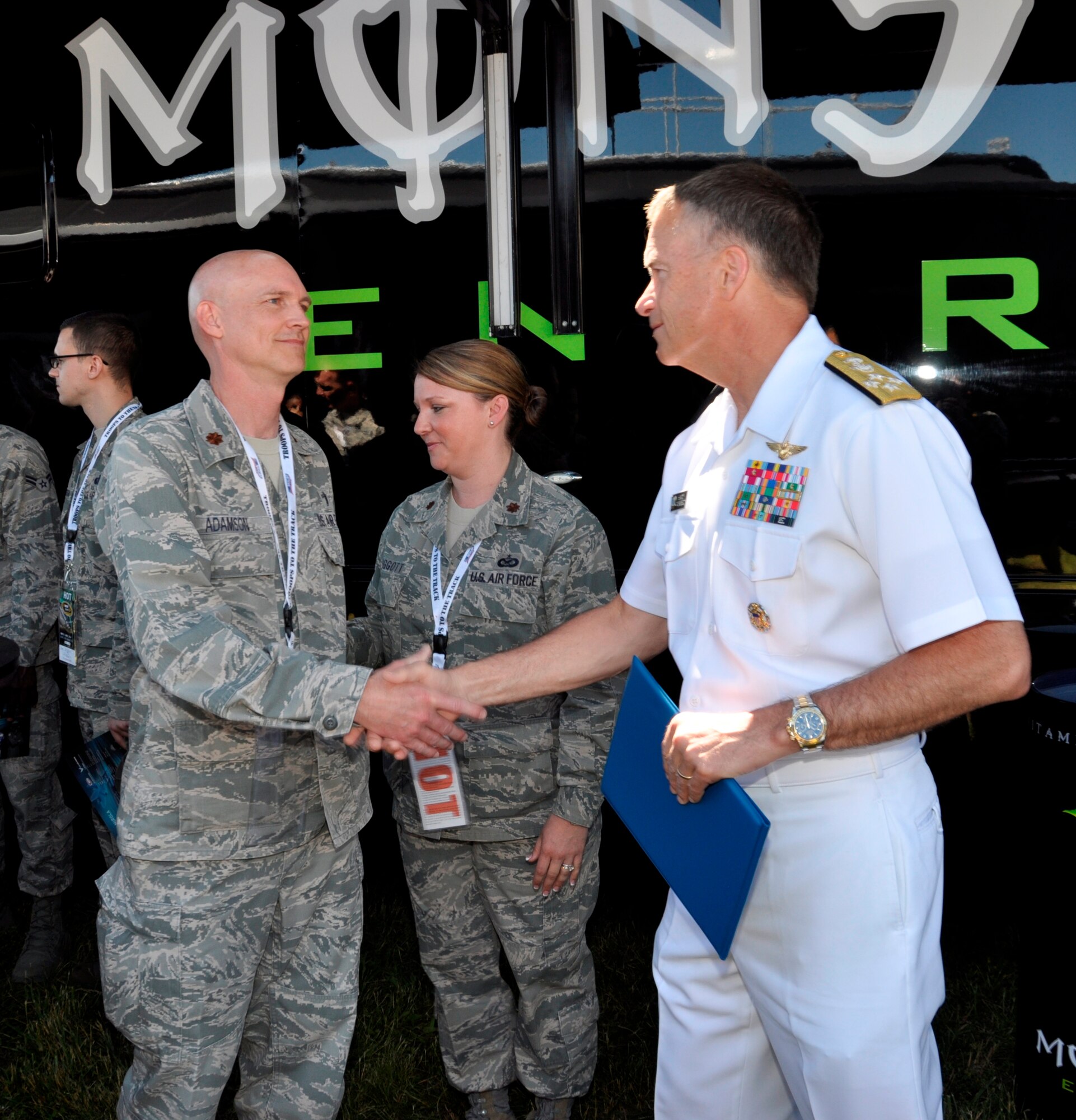 Air Force Chaplain (Maj.) Martin Adamson meets Admiral James A. Winnefeld, Jr., Vice Chairman of the Joint Chiefs of Staff, as part of the Armed Forces Foundation Troops to the Track program at Dover International Speedway, Dover, Del., June 1, 2014.  Adamson is deployed to Air Force Mortuary Affairs Operations from the 30th Space Wing, Vandenberg AFB, Calif. (U.S. Air Force photo/Staff Sgt. Lucas Morrow)