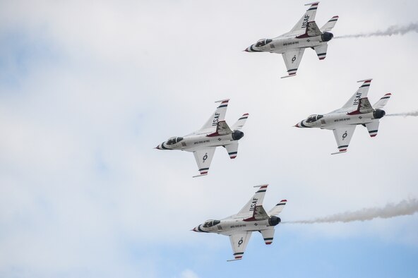 The U.S. Air Force Thunderbirds aerial demonstration team fly their F-16C Fighting Falcons in the diamond formation June 1, 2014, in the skies over Fairchild Air Force Base, Wash., during the base's SkyFest 2014 air show and open house. In support of the event, a C-17 Globemaster III and its crew from Joint Base Lewis-McChord, Wash., transported the demonstration team's support personnel and equipment from Colorado Springs, Colo., to the event at Fairchild. (U.S. Air Force photo/Tech. Sgt. Sean Tobin)
