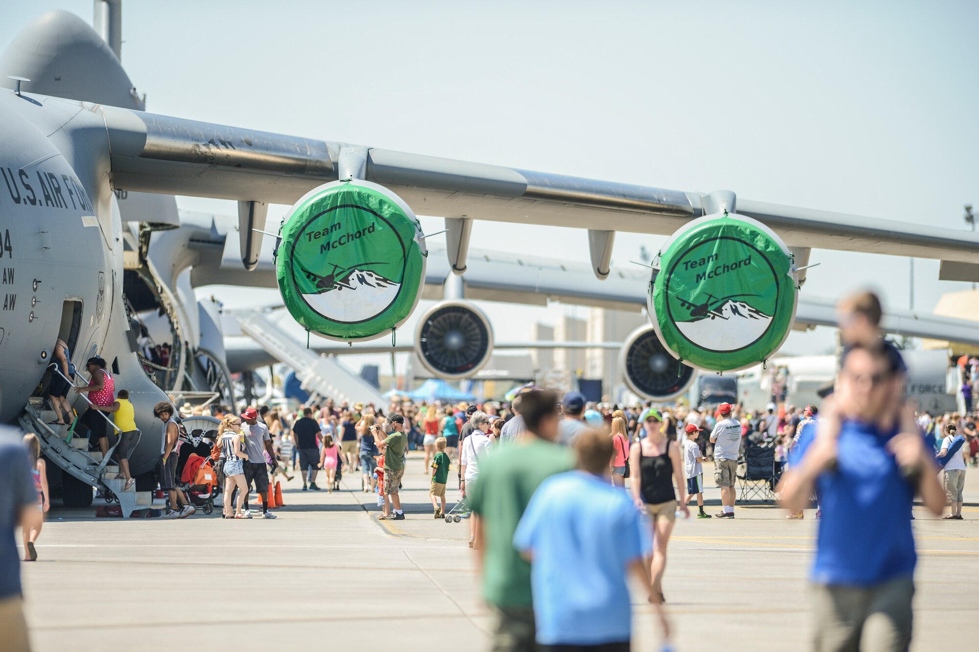 Air show attendees board a C-17 Globemaster III June 1, 2014, during SkyFest 2014 at Fairchild Air Force Base, Wash. During the two-day air show and open house, the base opened its gates to approximately 210,000 visitors who were entertained by various aerial performances and aircraft static displays, including the McChord C-17. (U.S. Air Force photo/Tech. Sgt. Sean Tobin)