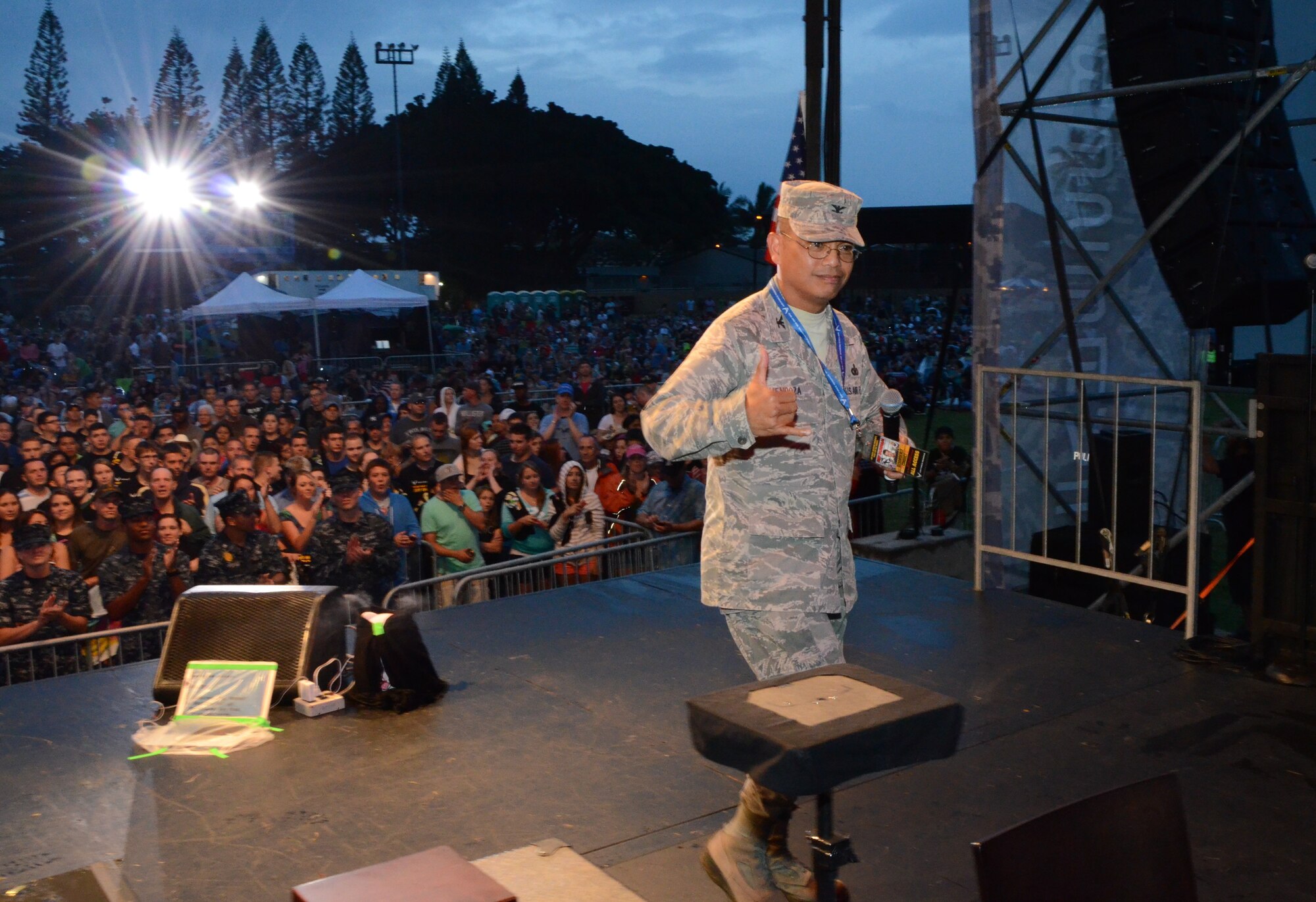 Col. Maynard "Max" Mendoza, commander of the 624th Regional Support Group, Joint Base Pearl Harbor-Hickam, Hawaii, flashes a Hawaiian "shaka" to convey the aloha spirit as he departs the stage at a Memorial Day weekend event held at Ward Field, Naval Station Pearl Harbor, Joint Base Pearl Harbor-Hickam, Hawaii, May 24, 2014. Mendoza gave opening remarks, promoting the Air Force Reserve and introducing well-known ventriloquist and comedian Jeff Dunham who performed for the 8,500-strong crowd. (U.S. Air Force photo by Tech. Sgt. Phyllis Keith)