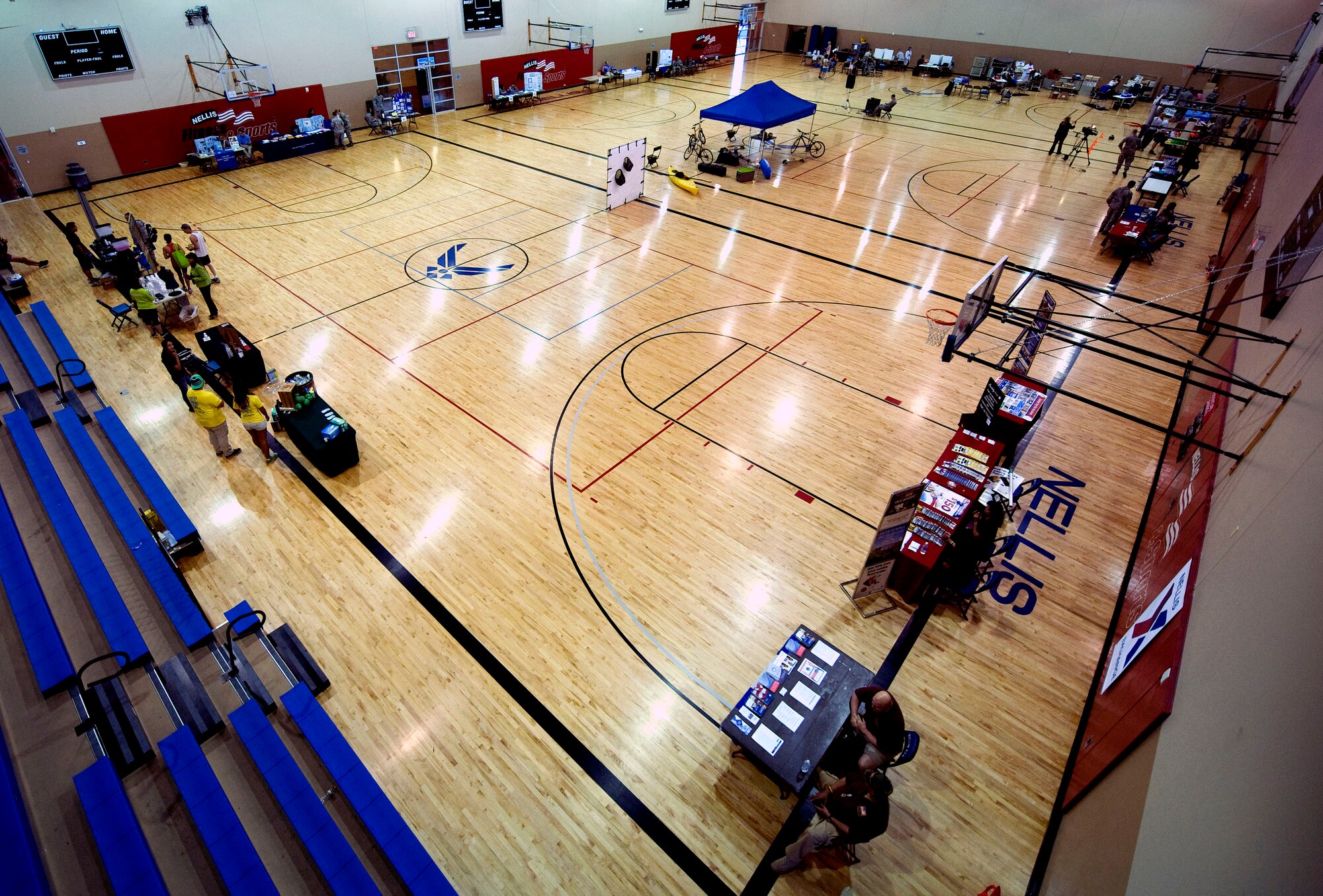 Informational health services prepare their booths for the Health Fair at the Warrior Fitness Center here May 30. The Health Fair was open to all Department of Defense ID cardholders and provided interactive health booths, blood drive and a showcase of fitness equipment. (U.S Air Force photo by Airman 1st Class Rachel Loftis)