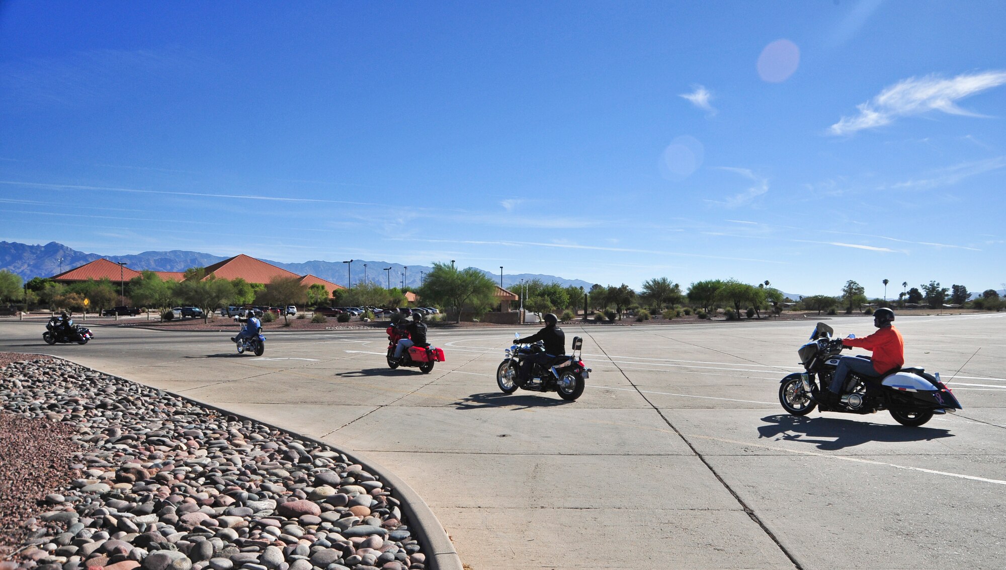 Desert Lightning Team members depart from Heritage Park during a motorcycle mentorship ride held for a Social Comprehensive Airman Fitness Day at Davis-Monthan Air Force Base, Ariz., June 2, 2014.  The social pillar of CAF encourages developing and maintaining trusted, valued friendships that are personally fulfilling and foster good communication, including the exchange of ideas, views and experiences.  (U.S. Air Force Photo by Airman 1st Class Chris Massey/Released)