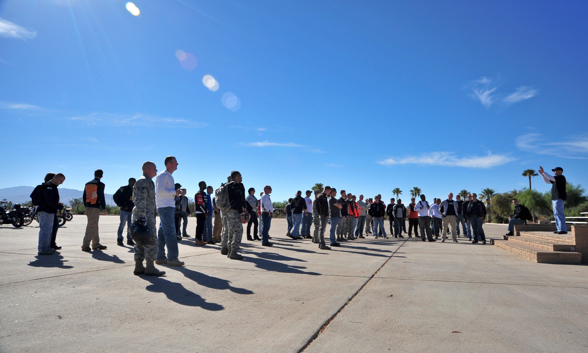 Desert Lightning Team members are given a safety briefing and route directions before departing for a Social Comprehensive Airman Fitness Day motorcycle mentorship ride that began at Davis-Monthan Air Force Base, Ariz., June 2, 2014.  Comprehensive Airman Fitness is an Air Force-wide initiative based on improving Airman readiness by solidifying the four pillars of CAF: mental, physical, social and spiritual. (U.S. Air Force Photo by Airman 1st Class Chris Massey/Released)