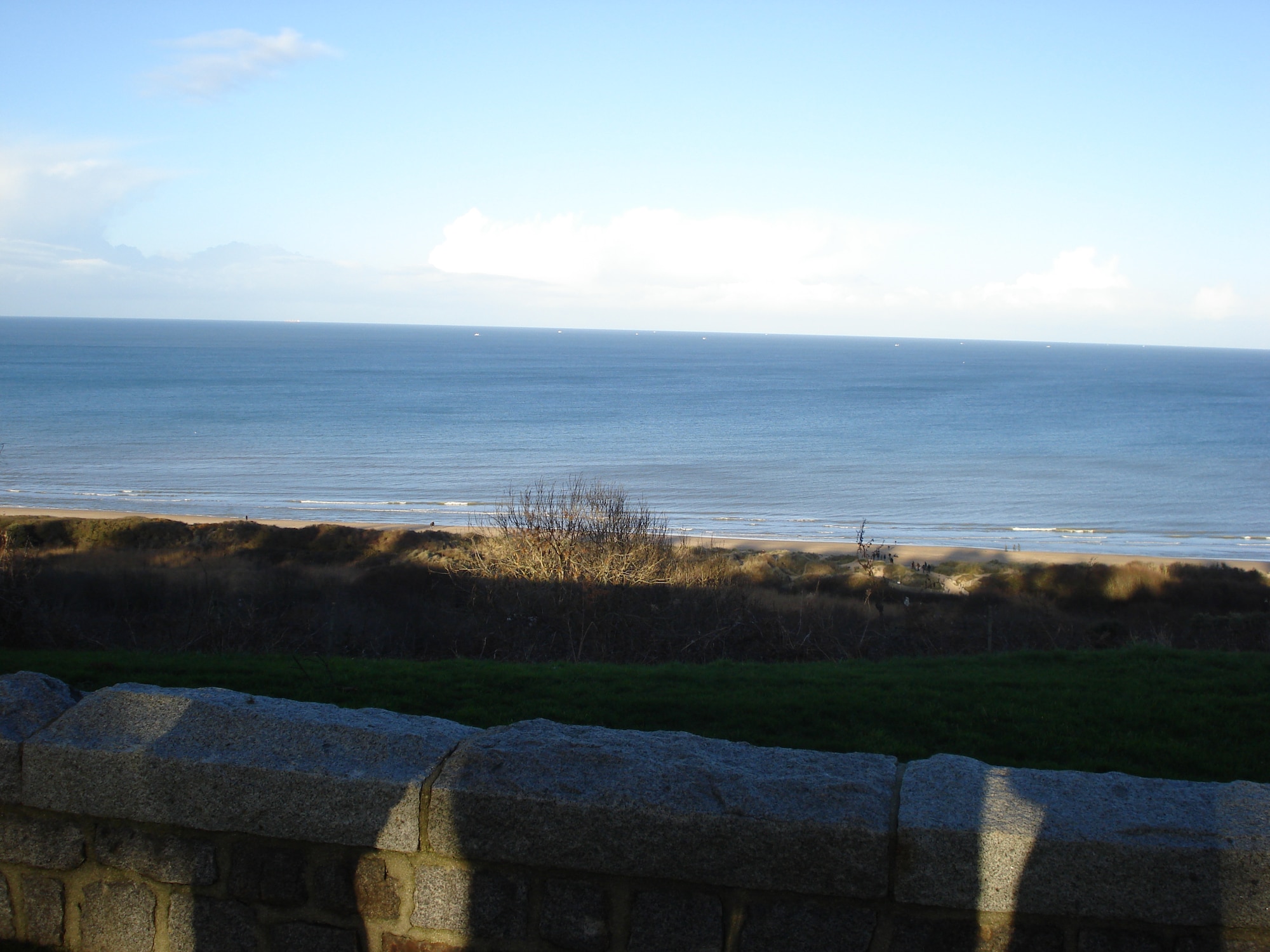 Omaha Beach lies next to the Normandy American Cemetery and Memorial in France.  The cemetery covers 172.5 acres and contains the graves of 9,387 military members. (Courtesy photo/Capt. Laura Balch/Released) 