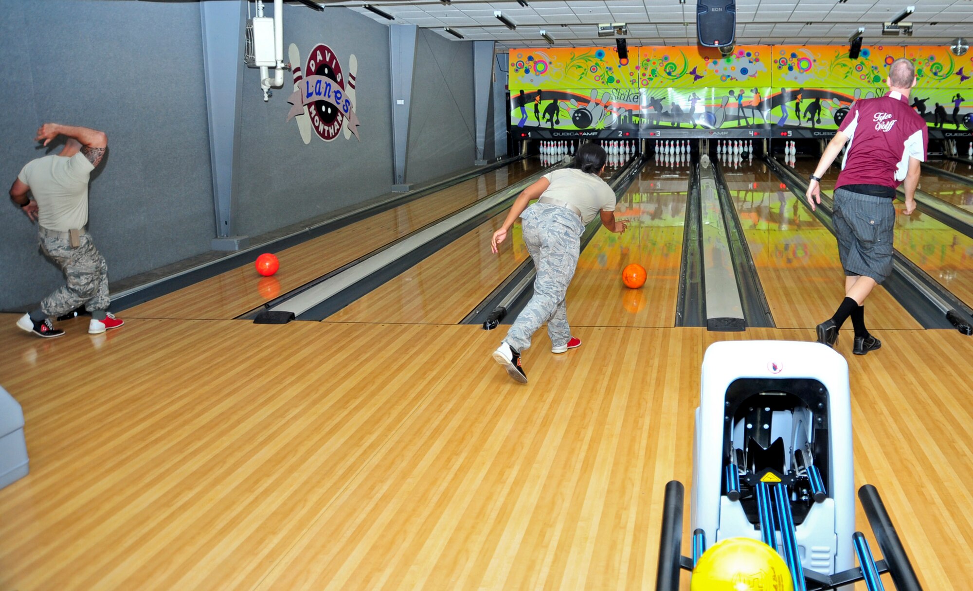 U.S. Air Force Airmen participate in a bowling event for Social Comprehensive Airman Fitness Day at Davis-Monthan Air Force Base, Ariz., June 2, 2014.  This event was one of many that Airmen were able to attend to recognize the social pillar of CAF. (U.S. Air Force Photo by Airman 1st Class Chris Massey/Released)