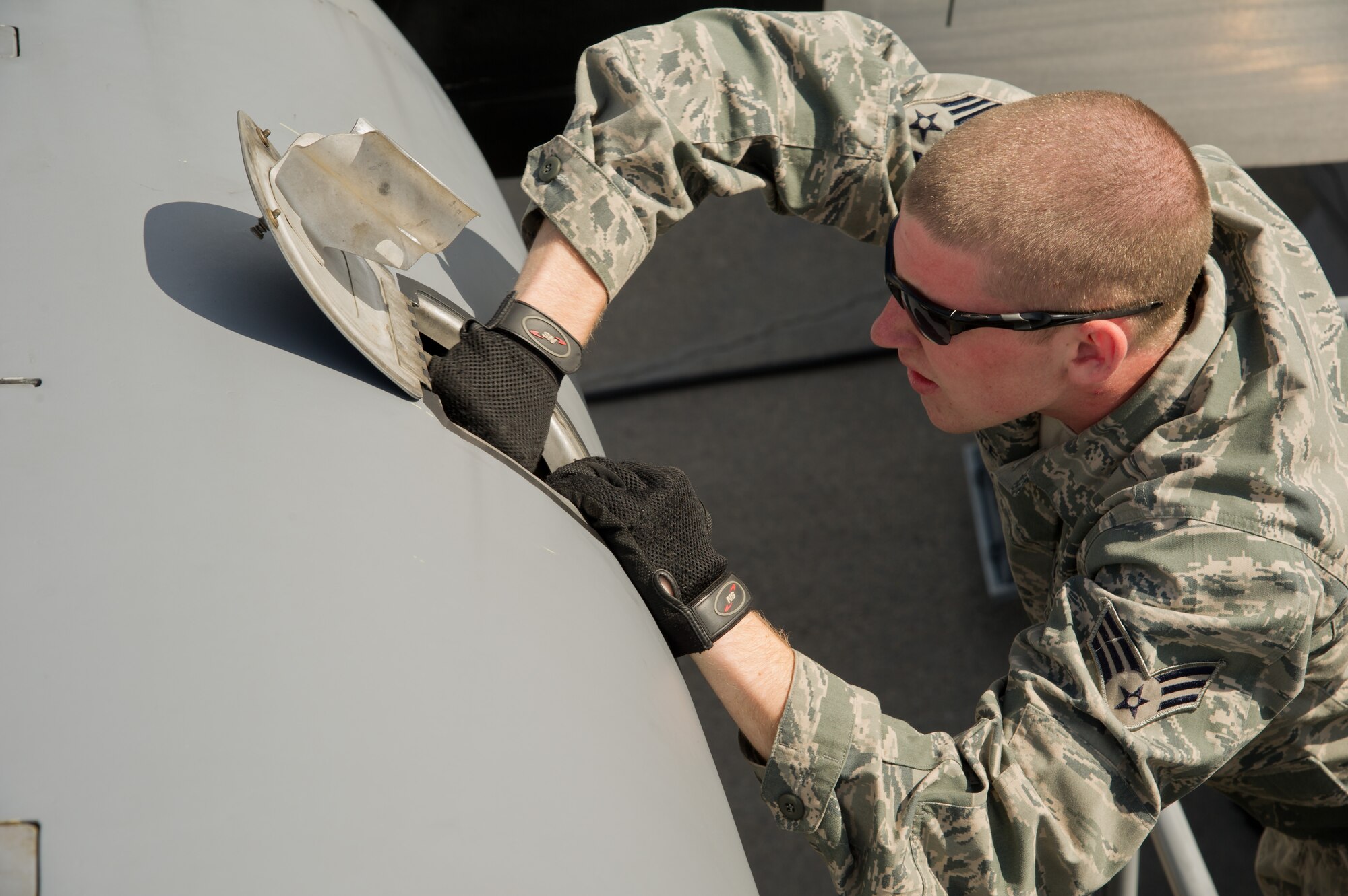 U.S. Air Force Senior Airman Kevin Foley, crew chief, 914th Airlift Wing, Niagara Falls Air Reserve Station, N.Y., checks the oil on the number 2 engine of a C-130 Hercules aircraft during Maple Flag 47 in Edmonton/Cold Lake, Alberta, Canada, May 30, 2014. Maple Flag is an international exercise designed to enhance the interoperability of C-130 aircrews, maintainers and support specialists in a simulated combat environment. (U.S. Air Force photo by Tech. Sgt. Matthew Smith)