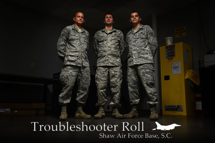[From left] U.S. Air Force Staff Sgt. Scott Williams, Tech Sgt. Michael Kelly and Staff Sgt. Laverne Borst, 20th Maintenance Group Air Force Repair Enhancement Program technicians, stand in their work environment at Shaw Air Force Base, S.C., May 21, 2014.  The three technician’s goal is to save the 20th Fighter Wing at least $100,000 each month by fixing broken parts instead of buying new ones. (U.S. Air Force photo illustration by Airman 1st Class Jensen Stidham/Released)