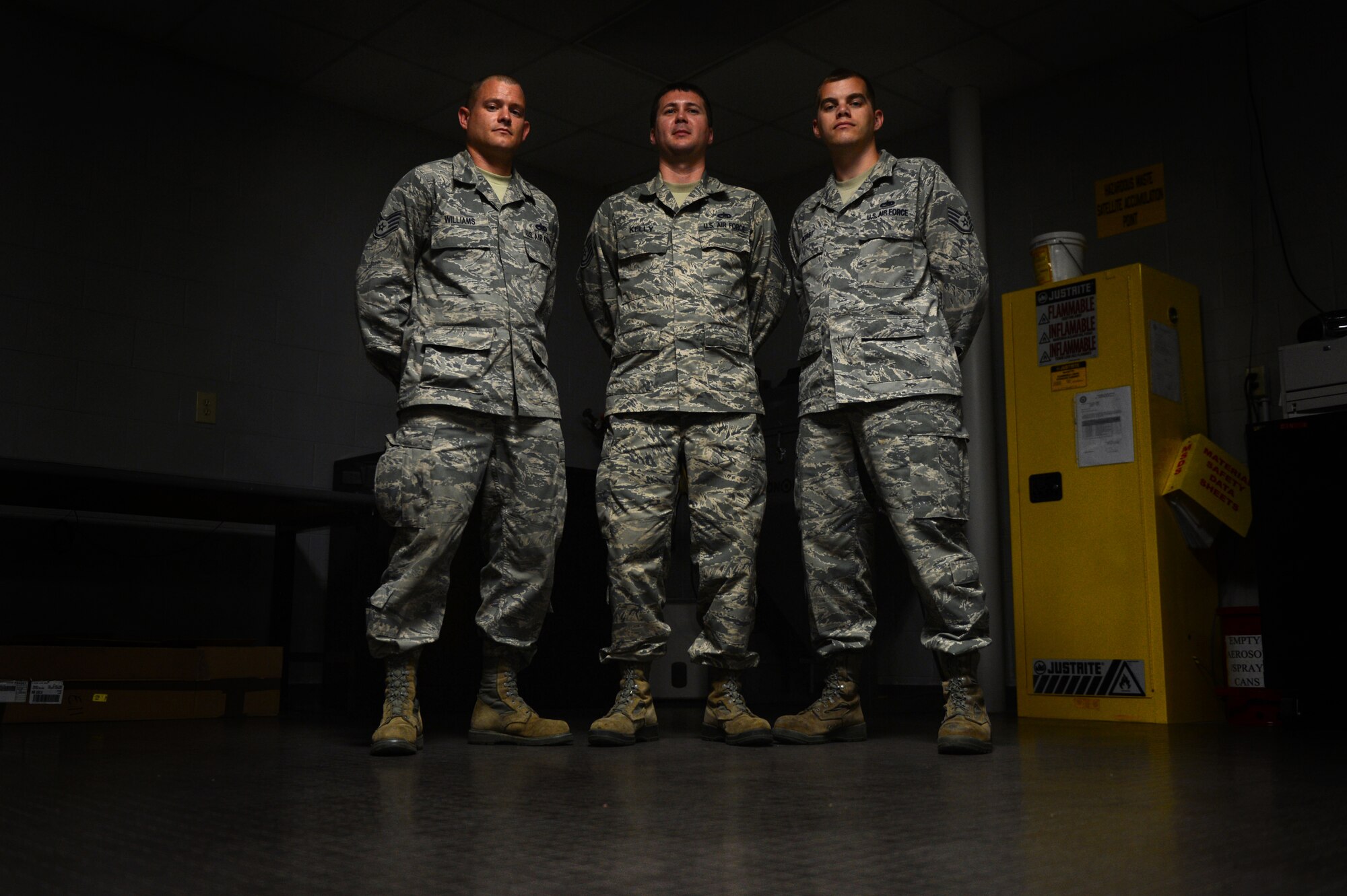 [From left] U.S. Air Force Staff Sgt. Scott Williams, Tech Sgt. Michael Kelly and Staff Sgt. Laverne Borst, 20th Maintenance Group Air Force Repair Enhancement Program technicians, stand in their work environment at Shaw Air Force Base, S.C., May 21, 2014.  The three technician’s goal is to save the 20th Fighter Wing at least $100,000 each month by fixing broken parts instead of buying new ones. (U.S. Air Force photo by Airman 1st Class Jensen Stidham/Released)