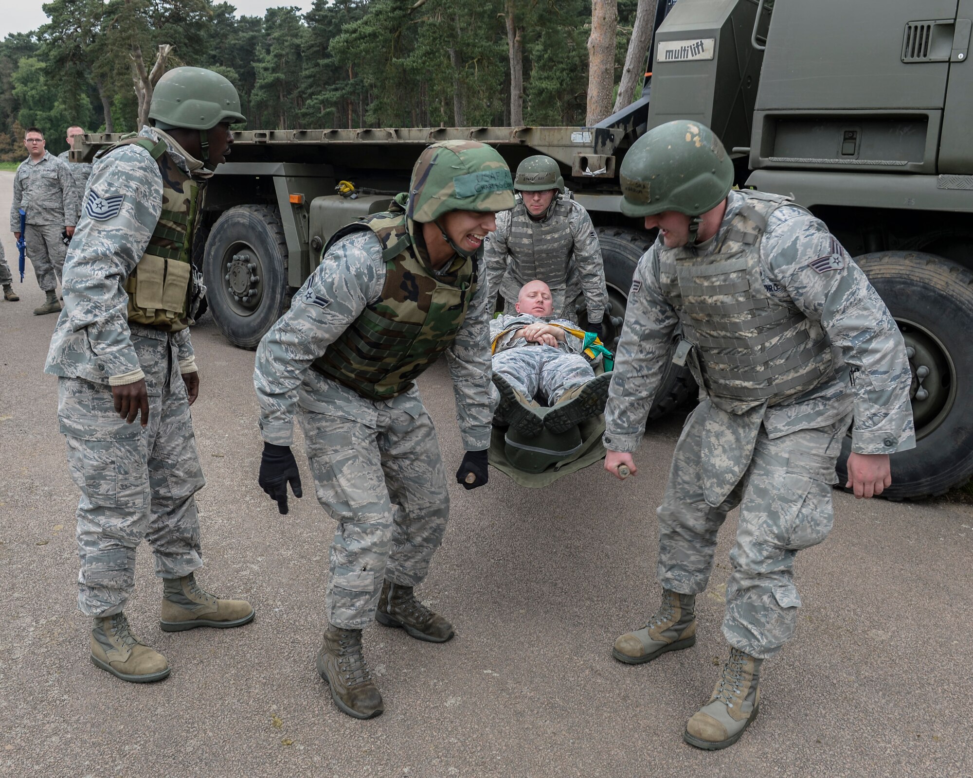 Maj. Jarod Blecher, 48th Logistic Readiness Squadron commander, receives medical attention during Combat Operation Readiness Training at Stanford Training Area, England, May 30, 2014. CORT allows Airmen to remain refined in procedures needed in a deployed environment. (U.S. Air Force photo by Airman 1st Nigel Sandridge/Released