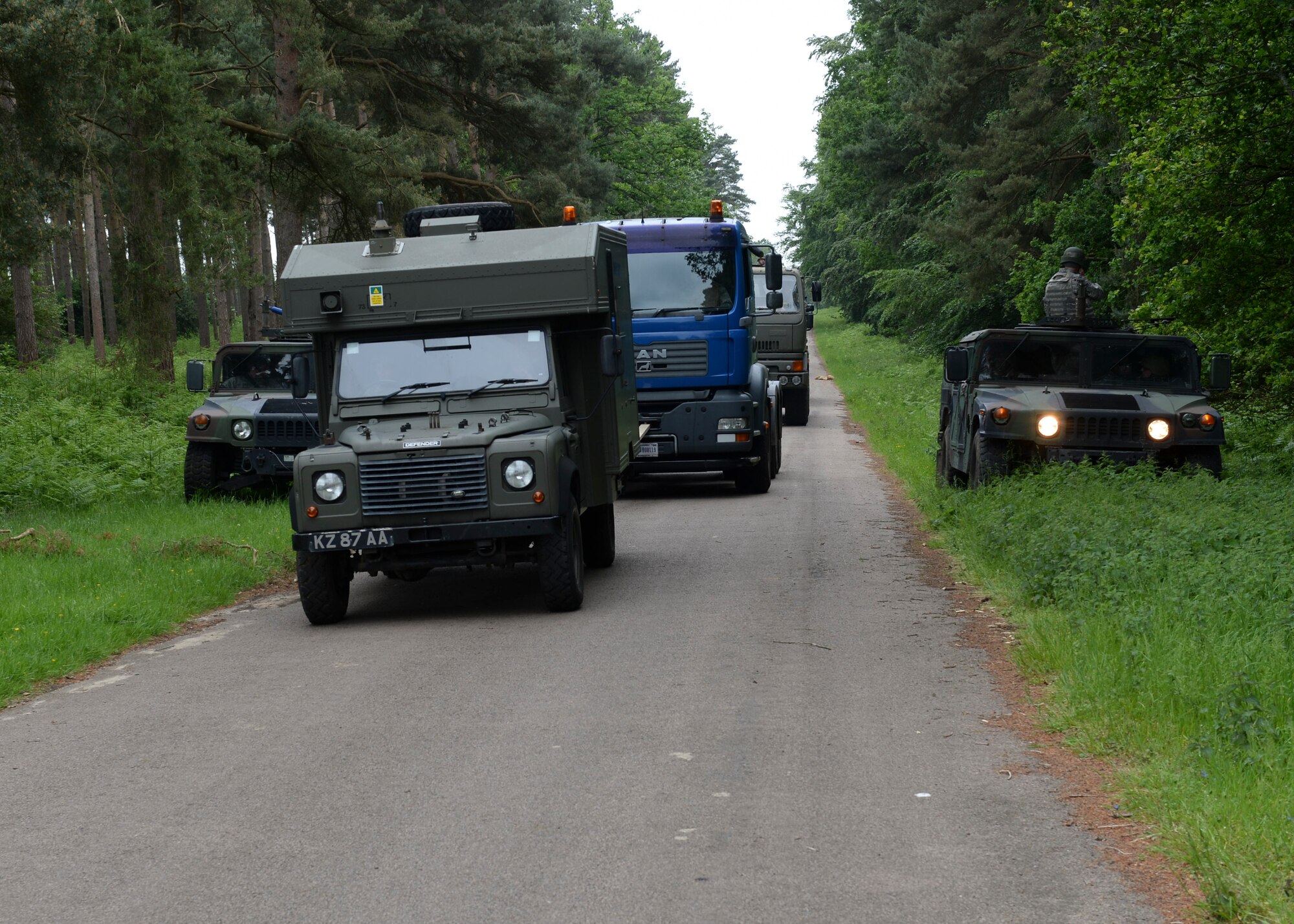 Cargo vehicles set up a defensive formation during Combat Operation Readiness Training at Stanford Training Area, England, May 30, 2014. U.S. and U.K. armed forces spent three days undergoing various training exercises from convoy tactical formation and self-aid and buddy care, to explosive device and ordnance detection and avoidance drills. (U.S. Air Force photo by Airman 1st Nigel Sandridge/Released)
