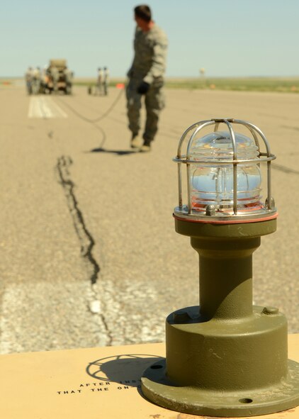Airmen from the 219th RED HORSE Squadron of the Montana Air National Guard set up a runway during a field training exercise at Malmstrom Air Force Base on May 30. One of RED HORSE’s wartime responsibilities is aircraft launch and recovery. (U.S. Air Force photo/Senior Airman Katrina Heikkinen)