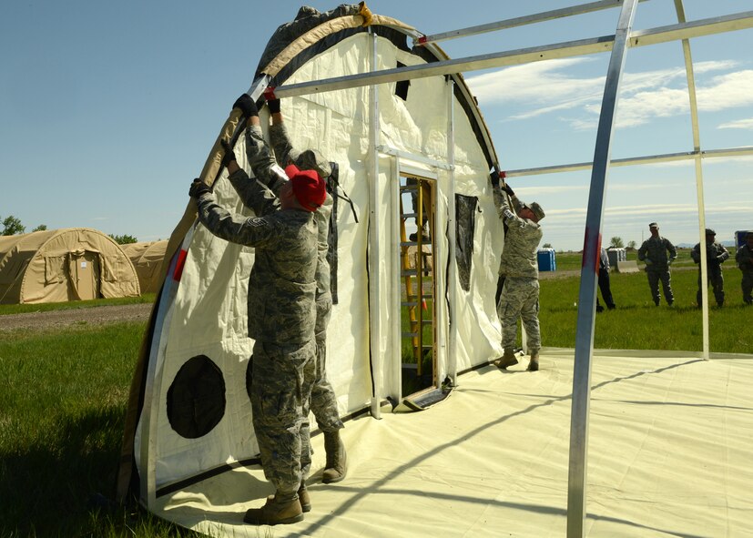 Members of the 219th RED HORSE Squadron set up a Disaster Relief Bed-down System at Malmstrom Air Force Base on May 29. The 219th RHS of the Montana Air National Guard conducted a field training exercise in conjunction with monthly drill May 29 to June 1. (U.S. Air Force photo/Senior Airman Katrina Heikkinen)