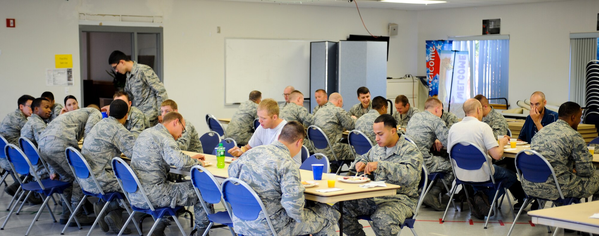 U.S. Air Force Airmen eat pancakes during a Comprehensive Airman Fitness Day at Davis-Monthan Air Force Base, Ariz., June 2, 2014. This quarter’s CAF Day was focused on improving Airmen readiness by solidifying the social pillar of CAF. (U.S. Air Force photo by Senior Airman Sivan Veazie/Released)