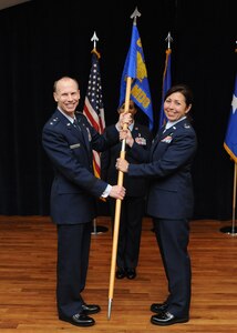 Maj. Gen. Bart O. Iddins, 59th Medical Wing commander, presents the 359th
Medical Group organizational guidon to Col. Dana James, during the unit's
change of command ceremony May 29, 2014 at Joint Base San Antonio-Randolph.
Iddins officiated the ceremony as Col. Althea B. B. Miller relinquished
command of the 359th MDG to James. James, a native of Reading, Pennsylvania,
previously commanded the 60th Medical Operations Squadron, Travis Air Force
Base, California. In 1987, she received her bachelor of science in nursing
from West Chester University, Pennsylvania, and was commissioned in the Air
Force in May 1989. James received her master of education in exercise
science and wellness from Wichita State University, Kansas, in 2001. James
is board-certified in nursing administration and has held various clinical
and administrative positions. (U.S. Air Force photo/Melissa Peterson)