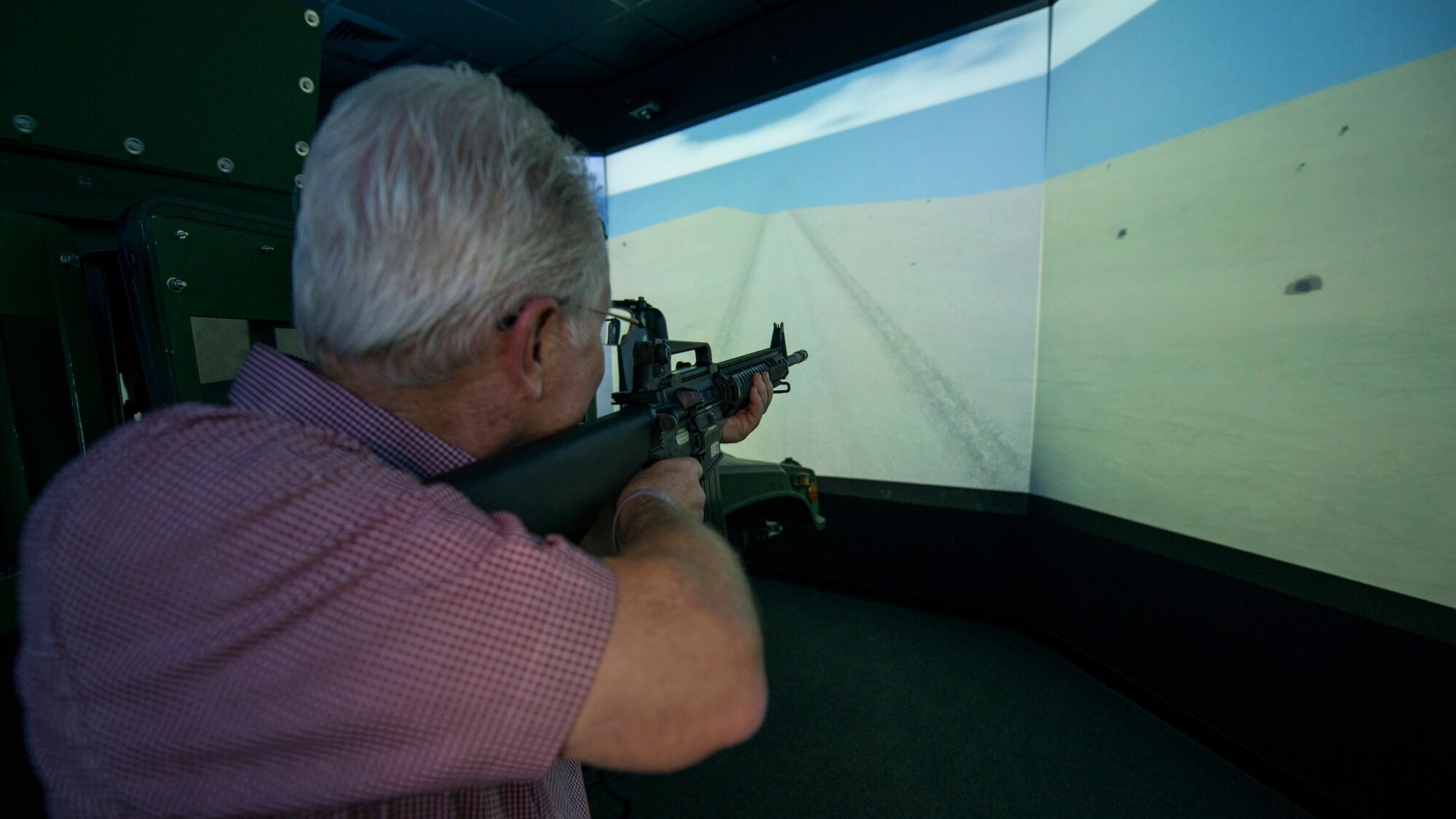 Nick Chubb engages enemy combatants with his M-16 inside the convoy simulator at Naval Construction Training Center Gulfport, Mississippi. The NCTC visit supplemented the tour for a group of Northwest Florida civic leaders to the Air Force Reserve’s 403rd Wing at Keesler Air Force Base, Mississippi.  Each year, the 919th Special Operations Wing invites local civic leaders on a tour of other Air Force Reserve units to increase their understanding of the diverse missions accomplished by the Reserve and other Department of Defense organizations.  (U.S. Air Force photo/Tech. Sgt. Jasmin Taylor)