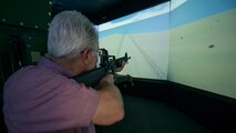 Nick Chubb engages enemy combatants with his M-16 inside the convoy simulator at Naval Construction Training Center Gulfport, Mississippi. The NCTC visit supplemented the tour for a group of Northwest Florida civic leaders to the Air Force Reserve’s 403rd Wing at Keesler Air Force Base, Mississippi.  Each year, the 919th Special Operations Wing invites local civic leaders on a tour of other Air Force Reserve units to increase their understanding of the diverse missions accomplished by the Reserve and other Department of Defense organizations.  (U.S. Air Force photo/Tech. Sgt. Jasmin Taylor)