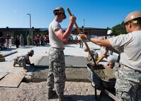 Northwest Florida civic leaders observe trainees constructing a concrete pad at Naval Construction Training Center Gulfport, Mississippi.  The NCTC visit supplemented the tour for a group of Northwest Florida civic leaders to the Air Force Reserve’s 403rd Wing at Keesler Air Force Base, Mississippi. Each year, the 919th Special Operations Wing invites local civic leaders on a tour of other Air Force Reserve units to increase their understanding of the diverse missions accomplished by the Reserve and other Department of Defense organizations.  (U.S. Air Force photo/Tech. Sgt. Jasmin Taylor)