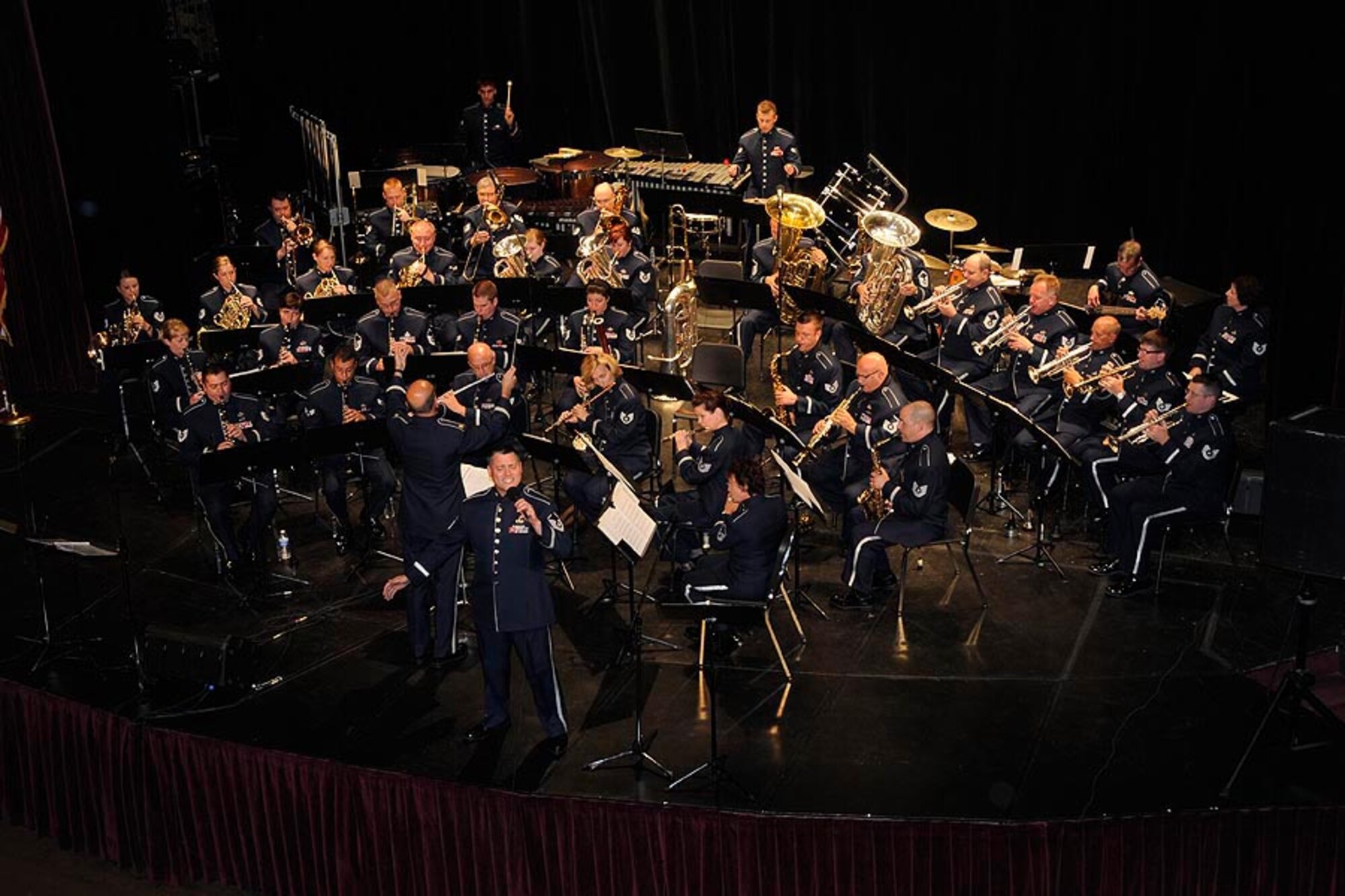 Airmen with the Air National Guard Band of the Midwest perform during their annual summer concert series July 1, 2013. Audiences can expect a world-class show with exciting and dynamic music, all while hearing the story of the ANG and the hometown heroes who serve in it, said commander and trumpet player U.S. Air Force Maj. Bryan Miller. The annual concert series is the result of a year’s worth of training and practice, one that the band uses to celebrate patriotism with communities across the Midwest. (U.S. Air National Guard photo by Tech. Sgt. Todd A. Pendleton/Released)