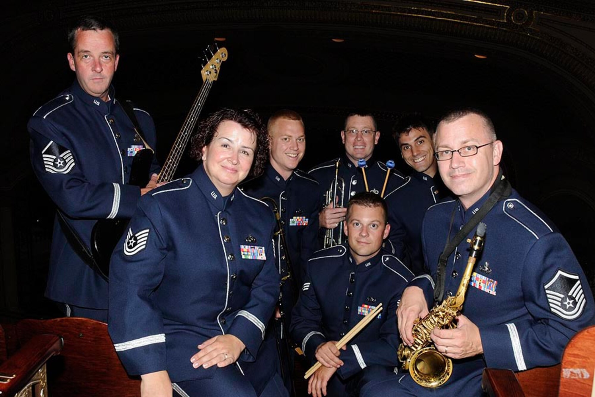 Airmen with the Air National Guard Band of the Midwest are seen between performances during their annual summer concert series July 1, 2013. Audiences can expect a world-class show with exciting and dynamic music, all while hearing the story of the ANG and the hometown heroes who serve in it, said commander and trumpet player U.S. Air Force Maj. Bryan Miller. The annual concert series is the result of a year’s worth of training and practice, one that the band uses to celebrate patriotism with communities across the Midwest. (U.S. Air National Guard photo by Tech. Sgt. Todd A. Pendleton/Released)