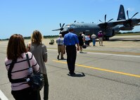 Northwest Florida civic leaders walk on the tarmac toward a parked Air Force Reserve WC-130J Hurricane Hunter aircraft during a tour at Keesler Air Force Base, Mississippi.  Each year, the 919th Special Operations Wing invites local civic leaders on a tour of other Air Force Reserve units to increase their understanding of the diverse missions accomplished by the Reserve and other Department of Defense organizations. (U.S. Air Force photo/Tech. Sgt. Jasmin Taylor)