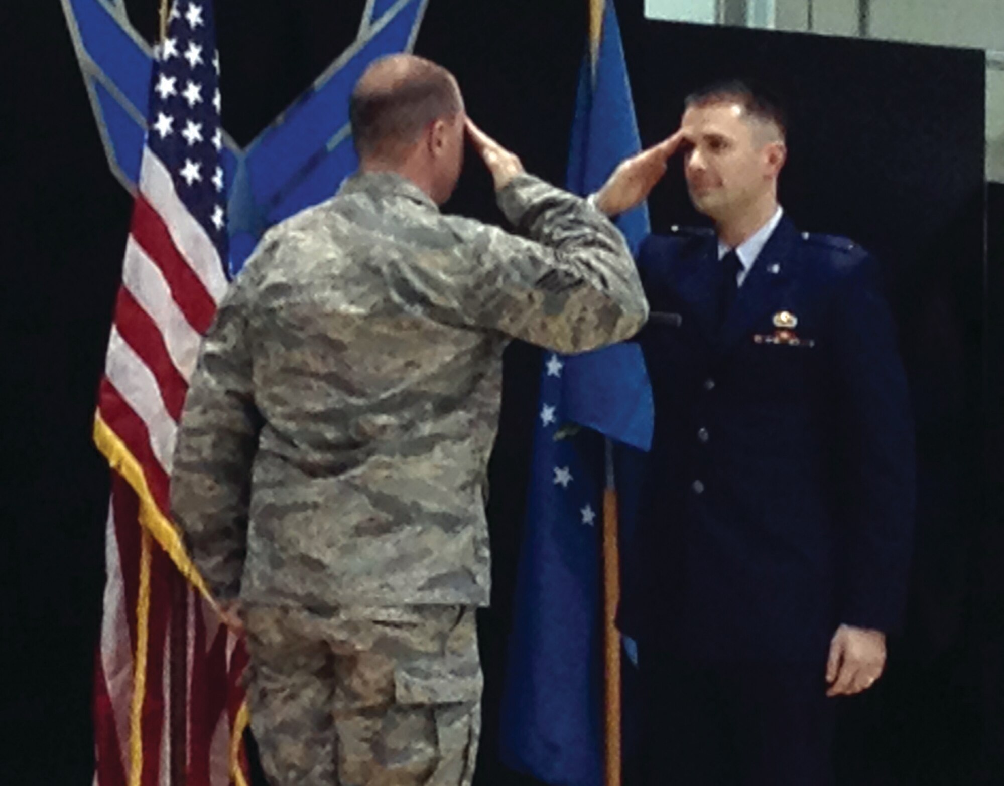 WRIGHT-PATTERSON AIR FORCE BASE, Ohio - First Lt. Alex Bilchak, 445th Aeromedical Evacuation Squadron, renders his first salute to Staff Sgt. Ronald Campbell, 445th Maintenance Squadron information management apprentice, his former co-worker while assigned to MXS, during his commissioning ceremony April 6, 2014. (Courtesy photo)