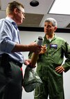 Air Force Reserve Lt. Col. Jeff Ragusa, 403rd Wing chief of safety, tells Ryan Price how the dropsonde he holds can transmit storm data during a tour of the wing’s world-famous Hurricane Hunters unit at Keesler Air Force Base, Mississippi. Ragusa is also an instructor pilot flying the unit's state-of-the-art WC-130J aircraft on weather reconnaissance missions. Each year, the 919th Special Operations Wing invites local civic leaders on a tour of other Air Force Reserve units to increase their understanding of the diverse missions accomplished by the Reserve and other Department of Defense organizations.  (U.S. Air Force photo/Tech. Sgt. Jasmin Taylor)