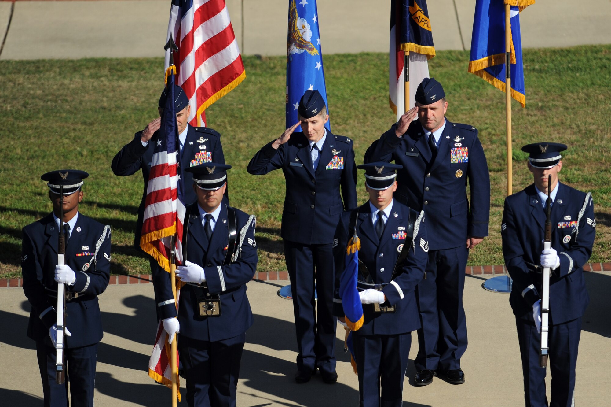 Maj. Gen. H.D. Polumbo Jr. (left), Ninth Air Force commander, and Cols. Jeannie Leavitt and Mark Slocum salute during the 4th Fighter Wing change of command ceremony, June 2, 2014, at Seymour Johnson Air Force Base, North Carolina. During the ceremony, Leavitt relinquished command to Slocum following a two year assignment as the 4th FW commander. (U.S. Air Force photo/Airman 1st Class Aaron J. Jenne)